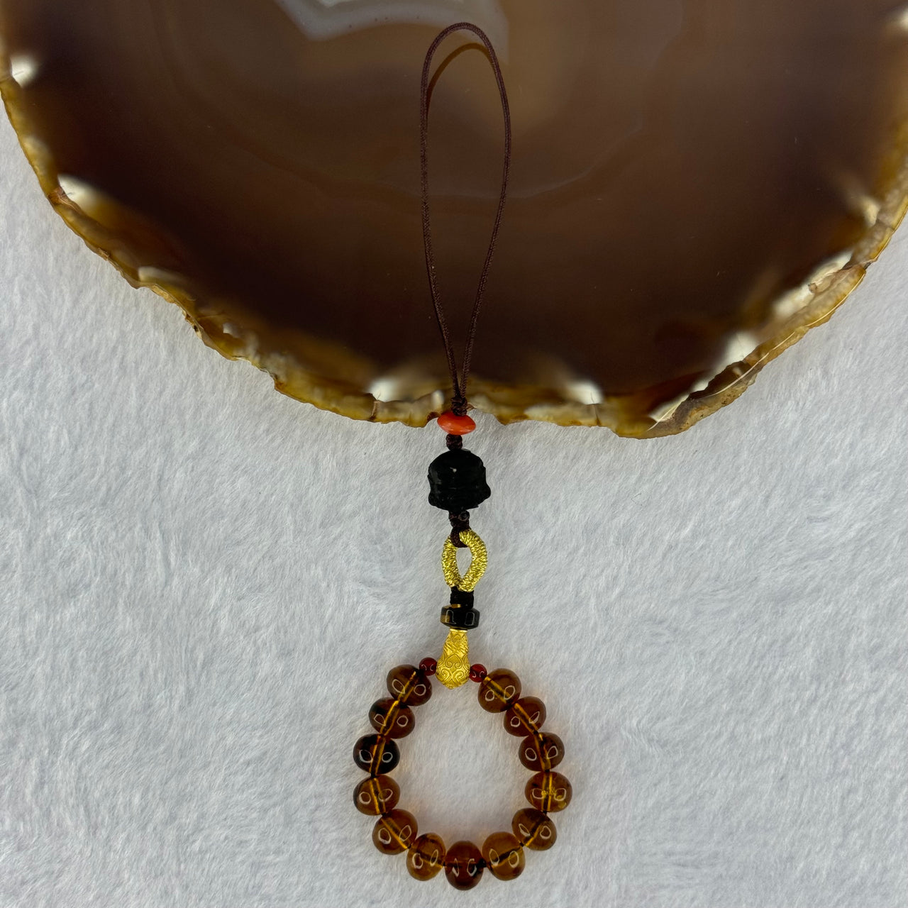 Natural Cognac Amber with Damo Head Handphone Strap 4.30g 7.6mm 13 Beads - Huangs Jadeite and Jewelry Pte Ltd