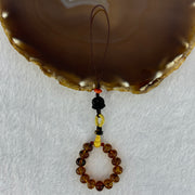Natural Cognac Amber with Damo Head Handphone Strap 4.30g 7.6mm 13 Beads - Huangs Jadeite and Jewelry Pte Ltd