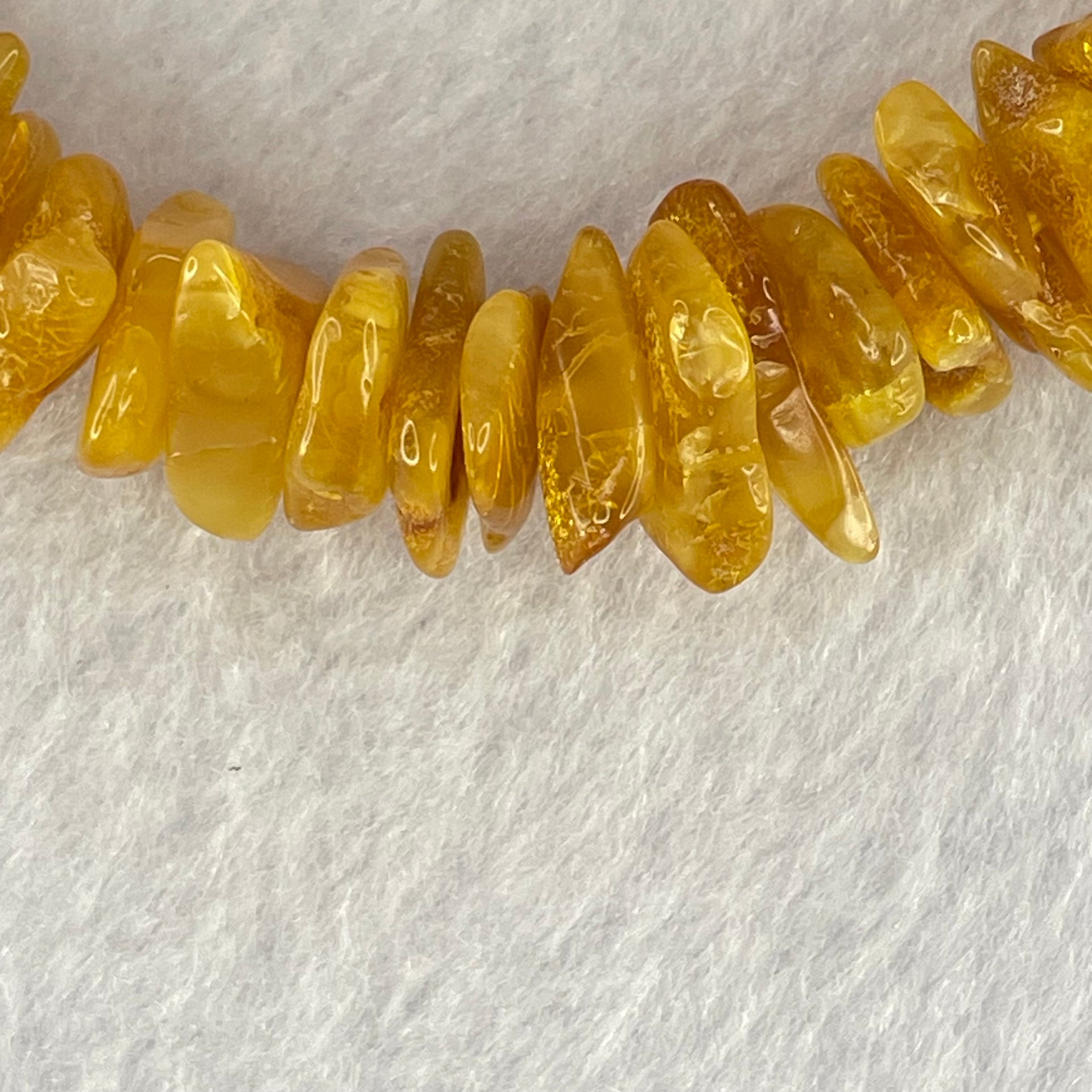 Natural Beeswax Raw Stone Irregular Beads Bracelet 天然蜜蜂蜡原石手链 17.97g 17cm 12.5 by 9.2 by 5.3mm 12.9 by 9.3 by 4.5mm 55pcs - Huangs Jadeite and Jewelry Pte Ltd