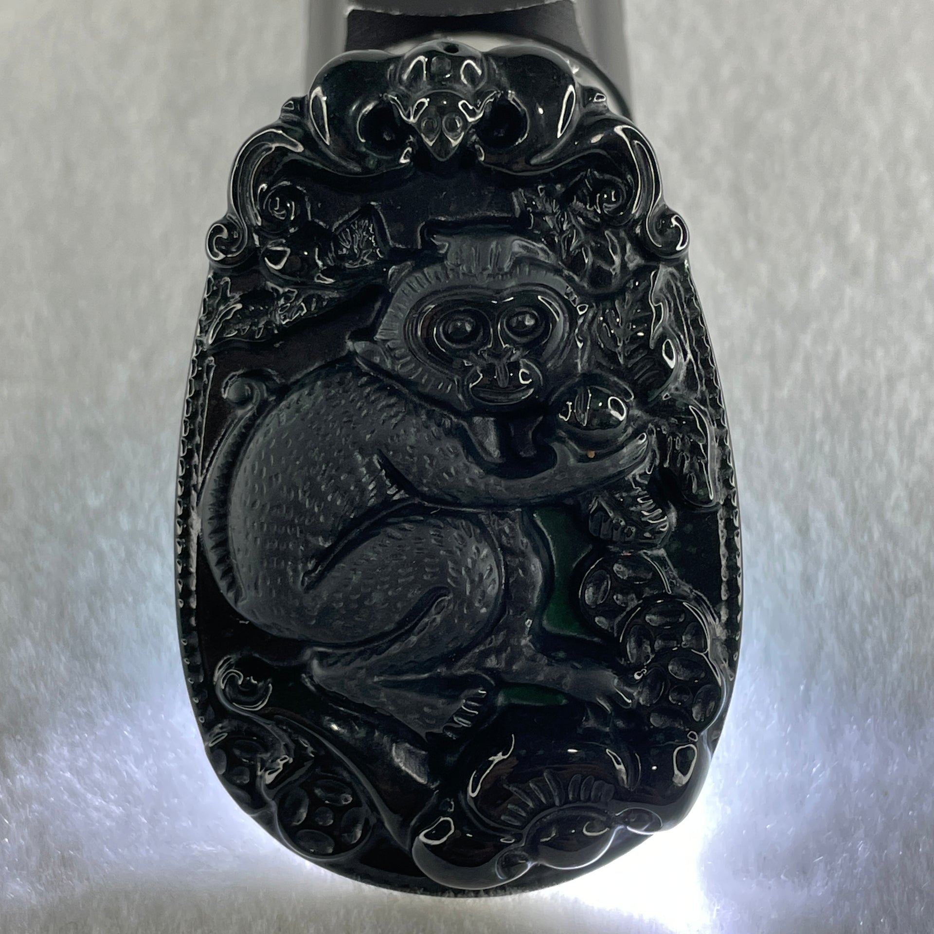 Type A Opaque to Partial Translucent Black Omphacite Jadeite Monkey Pendant 29.60g 59.6 by 40.1 by 8.5mm - Huangs Jadeite and Jewelry Pte Ltd