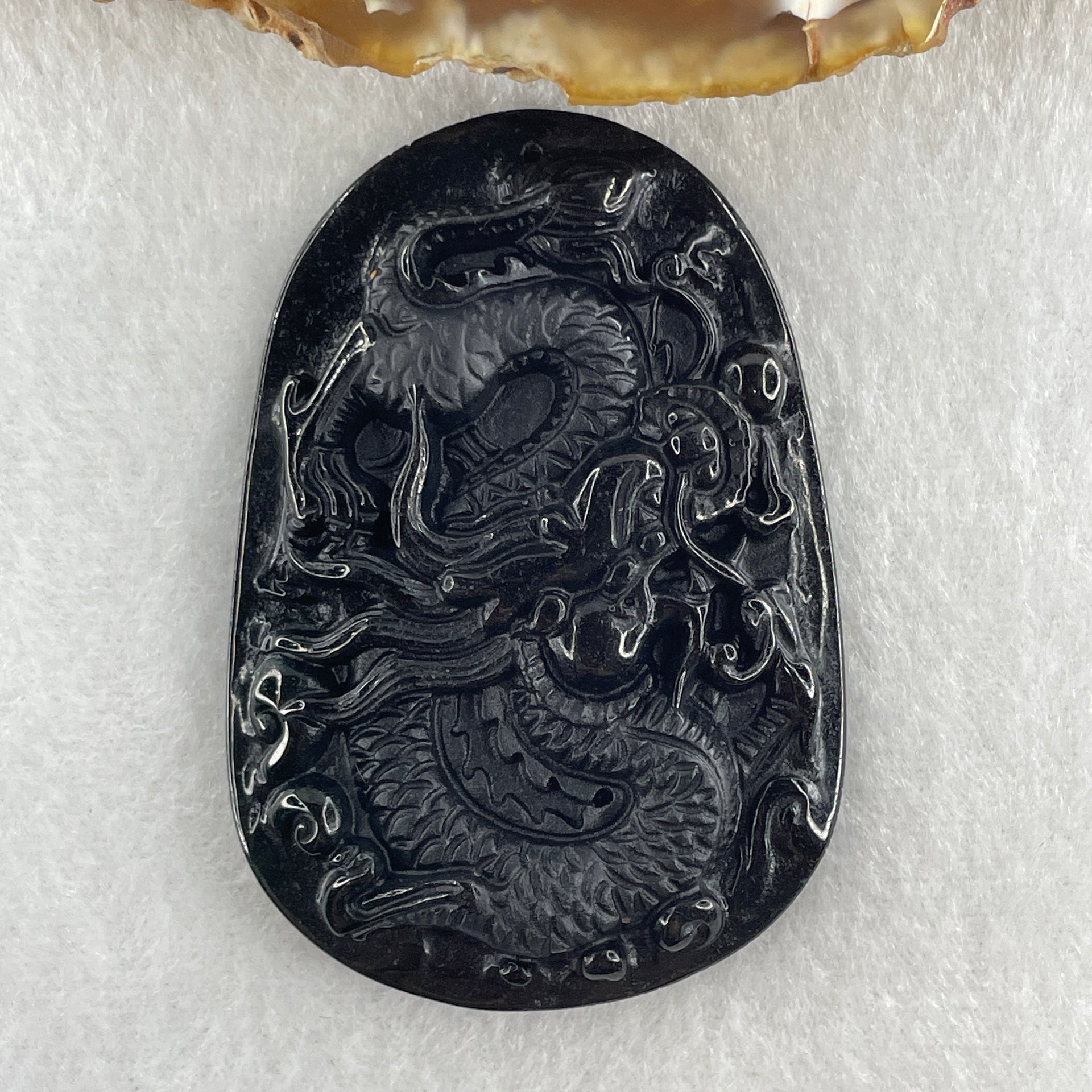 Type A Opaque to Partial Translucent Black Omphacite Jadeite Dragon Pendant 24.58g 58.2 by 40.3 by 8.2mm - Huangs Jadeite and Jewelry Pte Ltd
