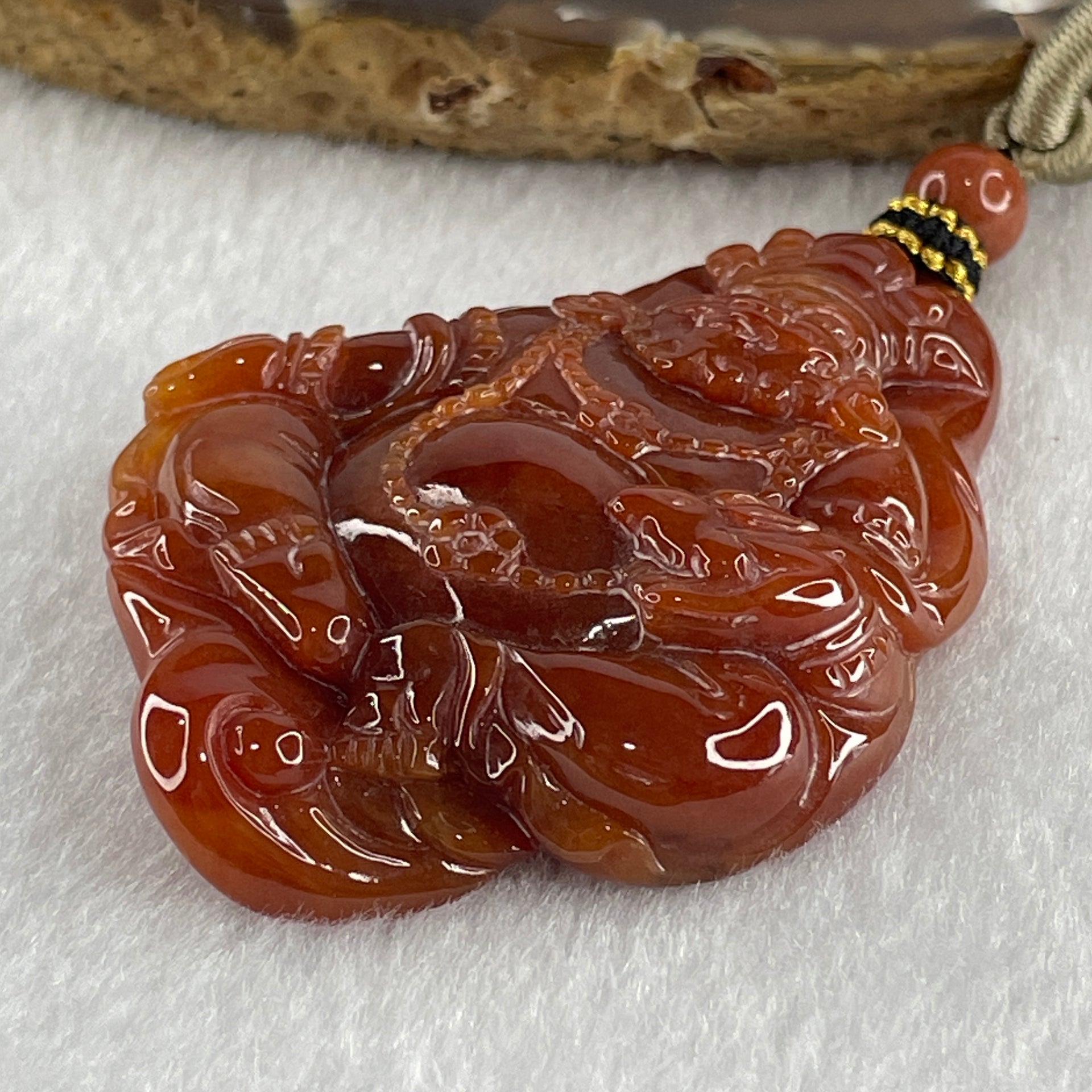 Type A Brownish Red Jadeite Jambhala Pendant 50.23g 63.6 by 45.6 by 1.5mm - Huangs Jadeite and Jewelry Pte Ltd
