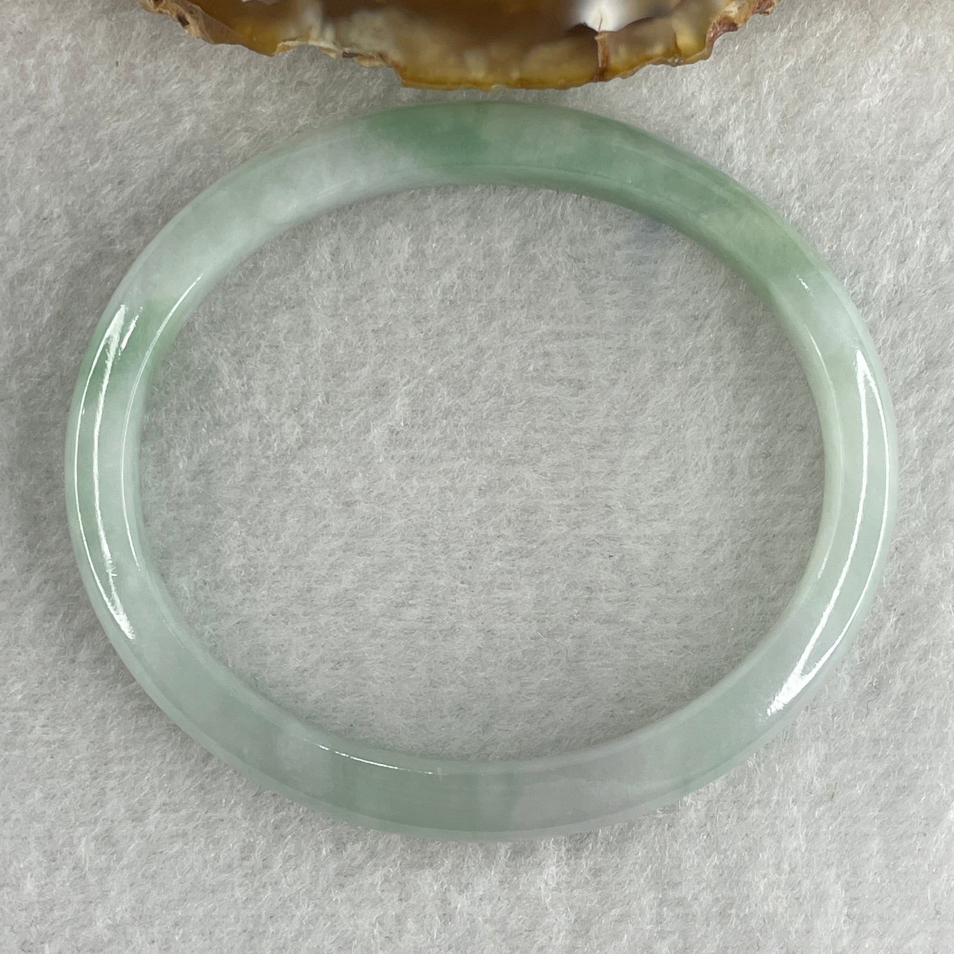 Certified Type A Light Green with Green Patches Jadeite Oval Bangle Internal Diameter 54.3mm 20.69g 7.5 by 6.4mm ( Very Slight Internal Lines ) - Huangs Jadeite and Jewelry Pte Ltd
