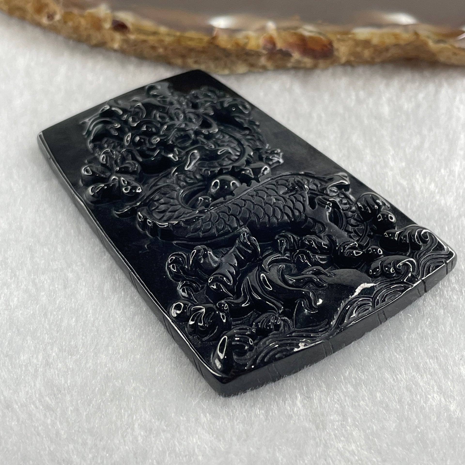 Type A Opaque to Partial Translucent Black Omphacite Jadeite Dragon Pendant 30.25g 64.4 by 42.8 by 8.2mm - Huangs Jadeite and Jewelry Pte Ltd