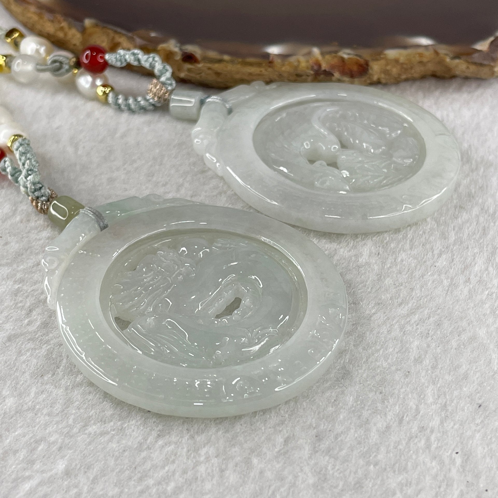 Grand Master Natural Colorless to Fain Green Jadeite Dragon and Phoenix Pendant 60.88g 54.8 by 47.9 by 6.0mm - Huangs Jadeite and Jewelry Pte Ltd