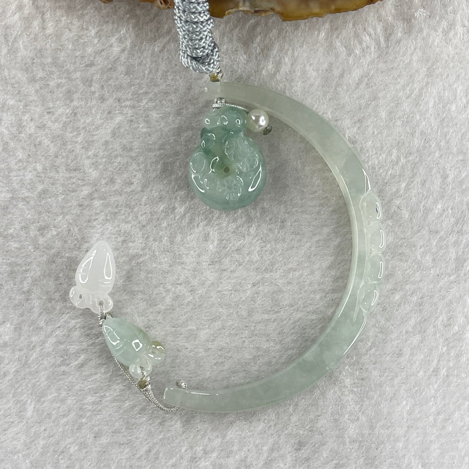 Natural Type A Semi Icy Light Green Jadeite Moon with Rabbit and Flower on Ping An Kou and Carrot Necklace 11.72g 17.2 by 13.6 by 8.6mm Ping An Kou - 56.7 by 4.4 by 5.5mm Moon - Huangs Jadeite and Jewelry Pte Ltd