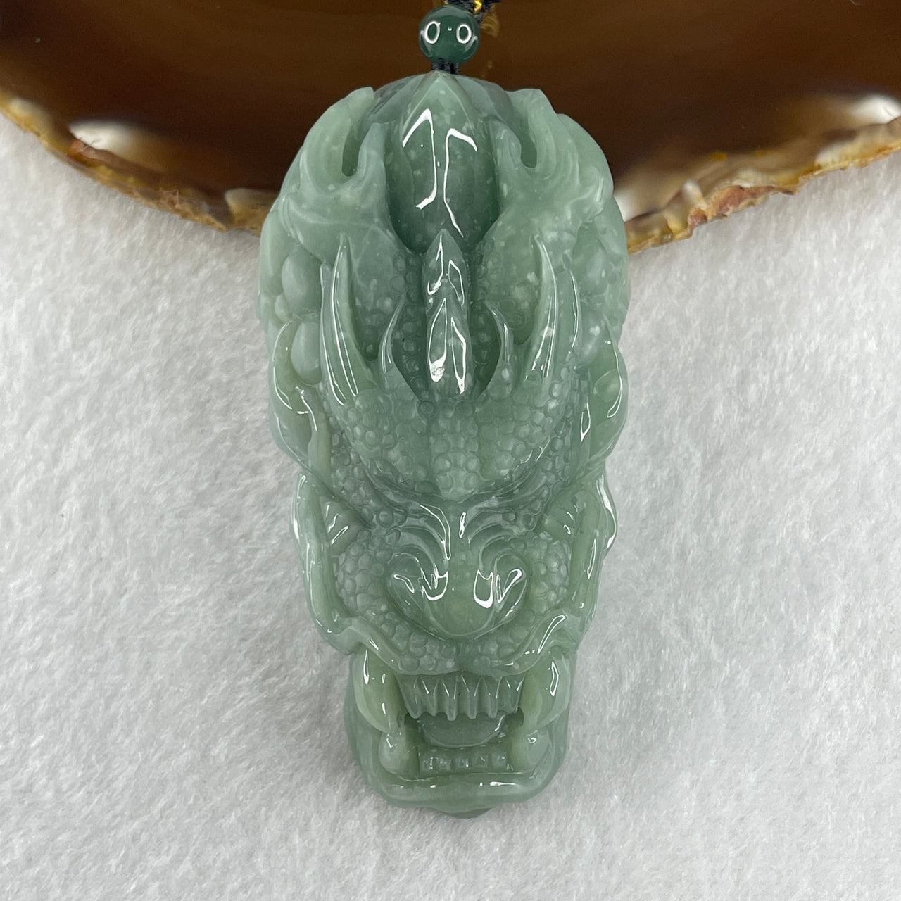 Natural Type A Blueish Green Jadeite Dragon Head Pendant 111.01g 78.0 by 40.7 by 22.2mm