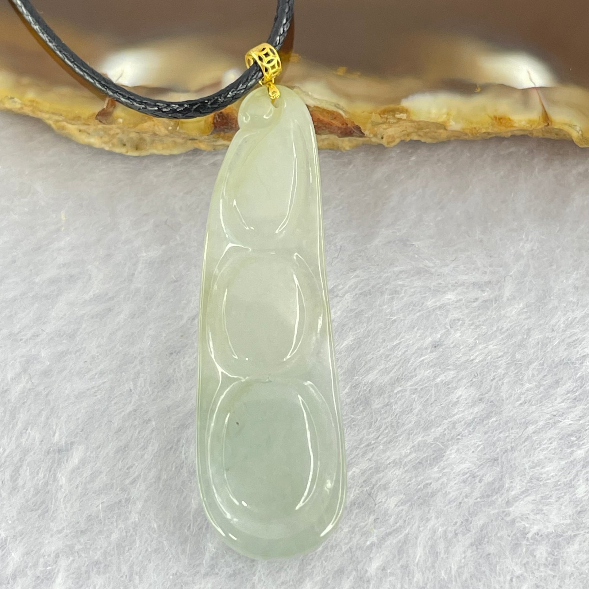 Type A Faint Green Jadeite Peapod Pendent 6.17g 39.1 by 11.3 by 7.1mm - Huangs Jadeite and Jewelry Pte Ltd