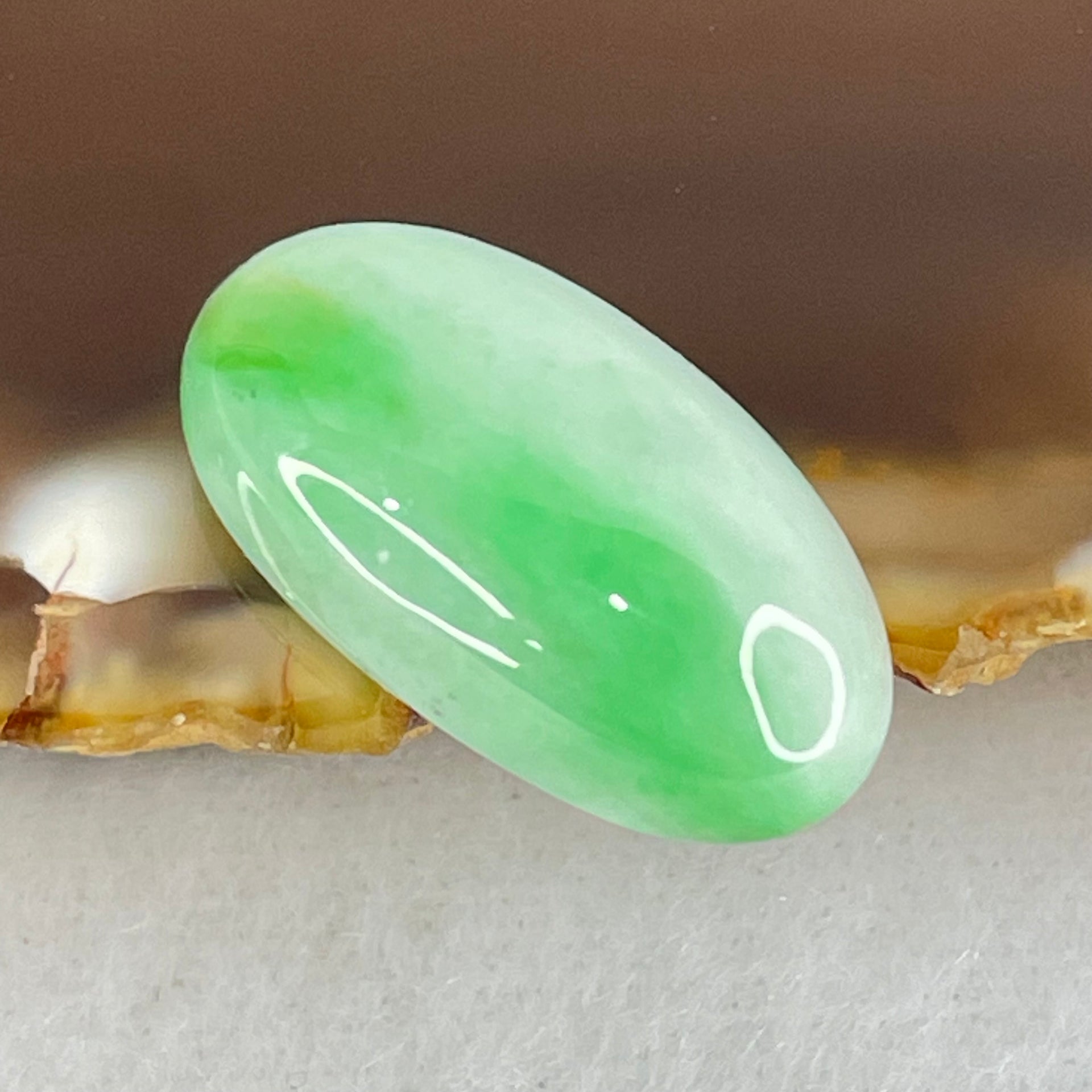 Type A Faint to Bright Apple Green Jadeite Oval Cabouchon Stone For Setting 2.34g 19.3 by 10.6 by 6.2mm - Huangs Jadeite and Jewelry Pte Ltd