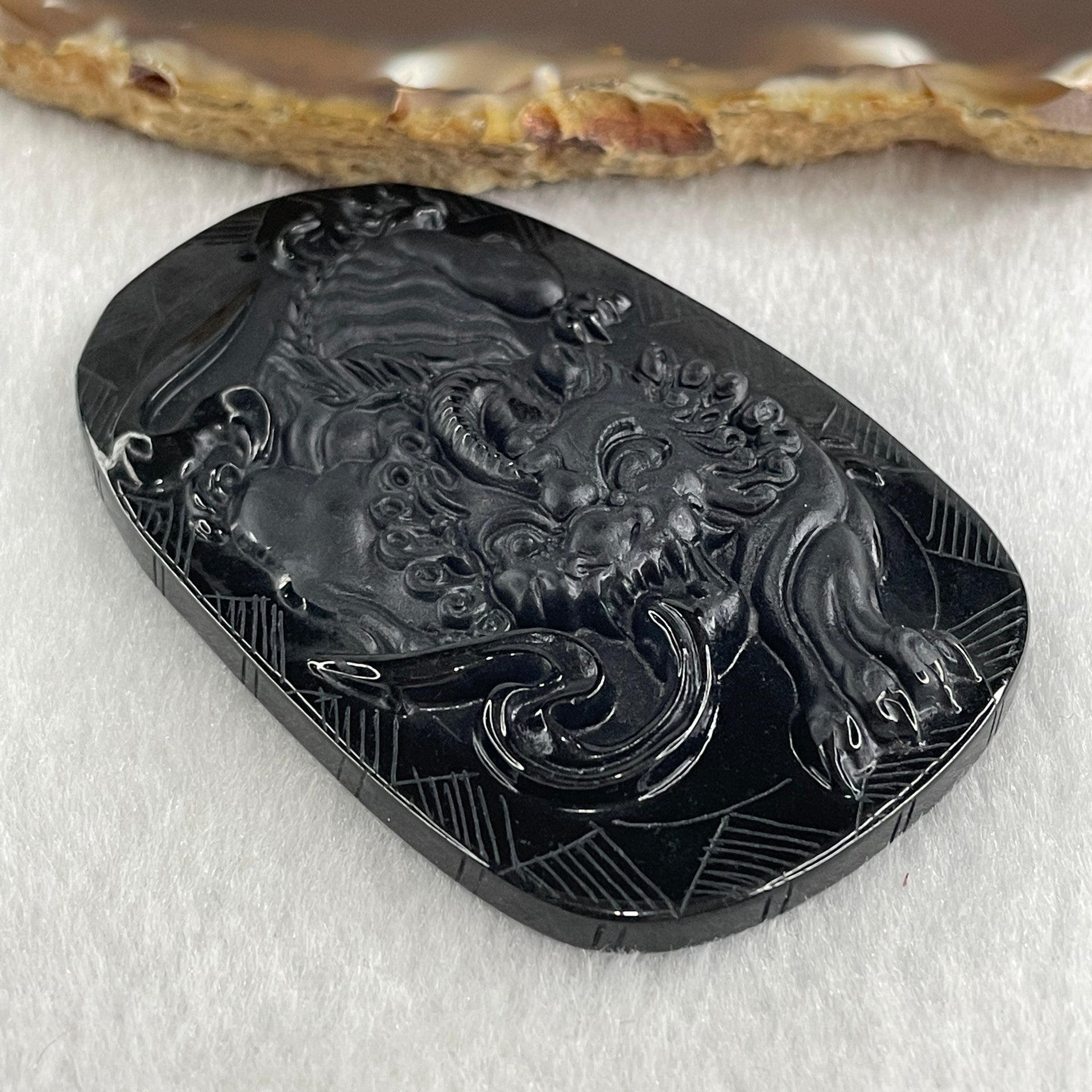 Type A Opaque to Partial Translucent Black Omphacite Jadeite Pixiu Pendant 23.77g 63.4 by 40.9 by 8.3mm - Huangs Jadeite and Jewelry Pte Ltd