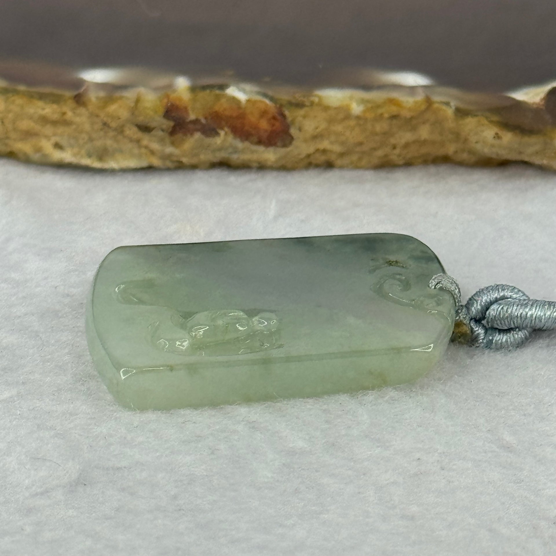 Type A Semi Icy Green Piao Hua Jadeite Shan Shui with Benefactor Gui Ren Pendent 13.79g 34.8 by 27.7 by 4.9mm - Huangs Jadeite and Jewelry Pte Ltd