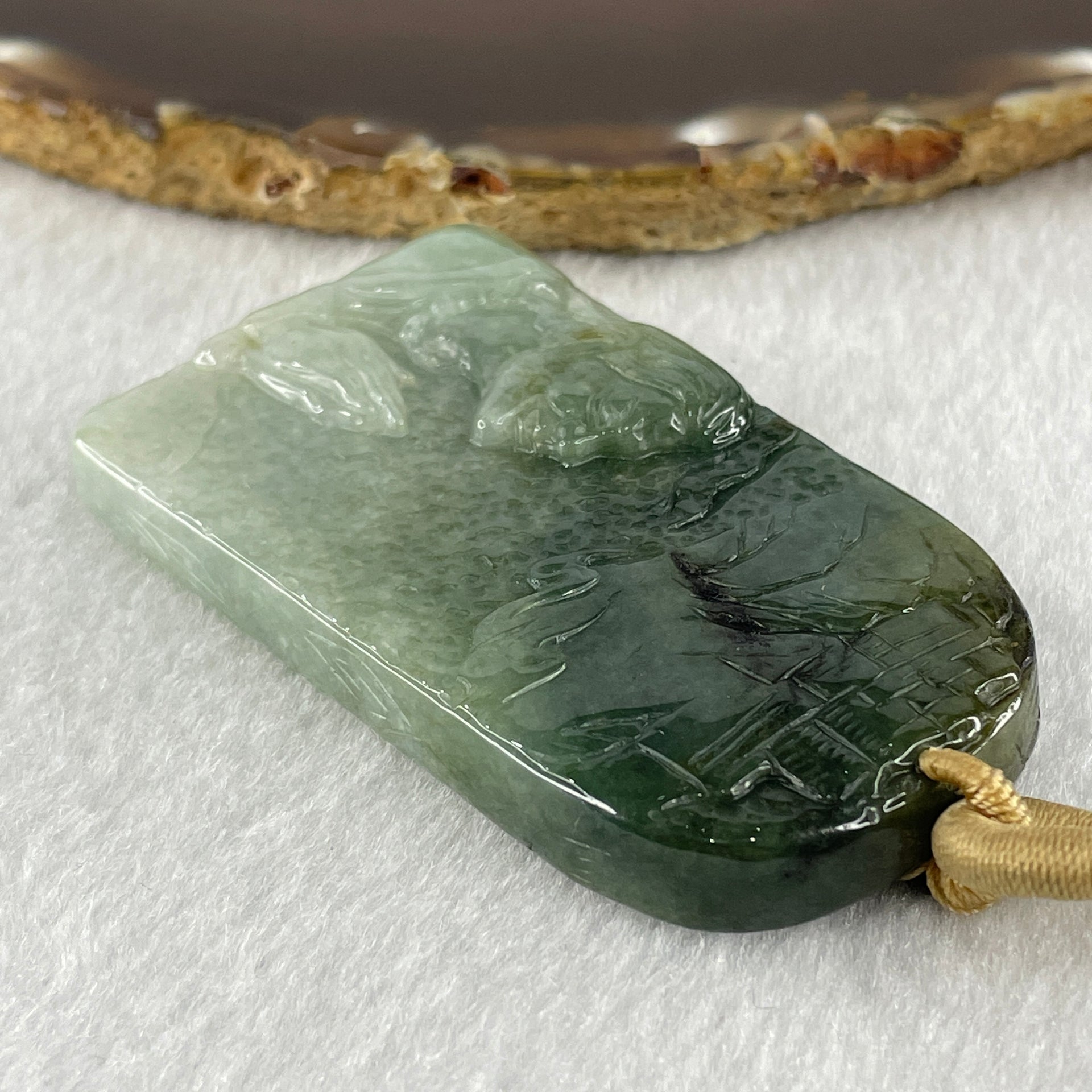 Natural Type A Light Green to Dark Green Jadeite People Seeking for Enlightenment Pendant 66.767g 64.1 by 39.0 by 11.0mm - Huangs Jadeite and Jewelry Pte Ltd
