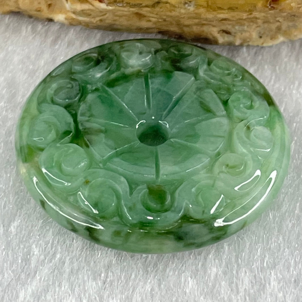 Type A Light Green with Emerald Green Jadeite Ping An Kou Donut with Flora Carvings Pendant 5.81g 14.6 by 5.4mm - Huangs Jadeite and Jewelry Pte Ltd