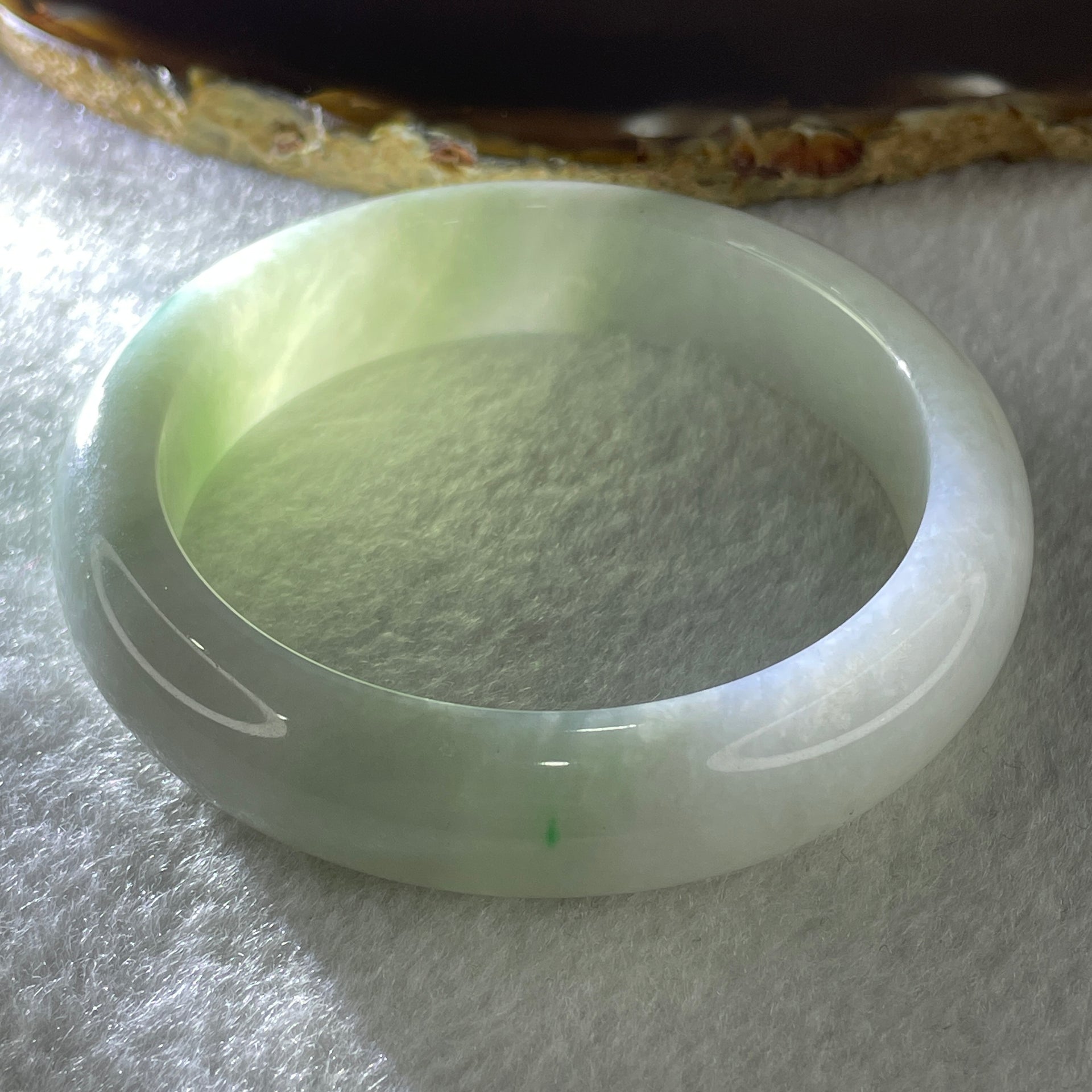 Type A Natural Jelly Light Green with Faint Lavender with Spicy Green Spot Jadeite Bangle 70.15g Inner Diameter 57.8mm 14.3 by 9.6mm (Close to Perfect) - Huangs Jadeite and Jewelry Pte Ltd