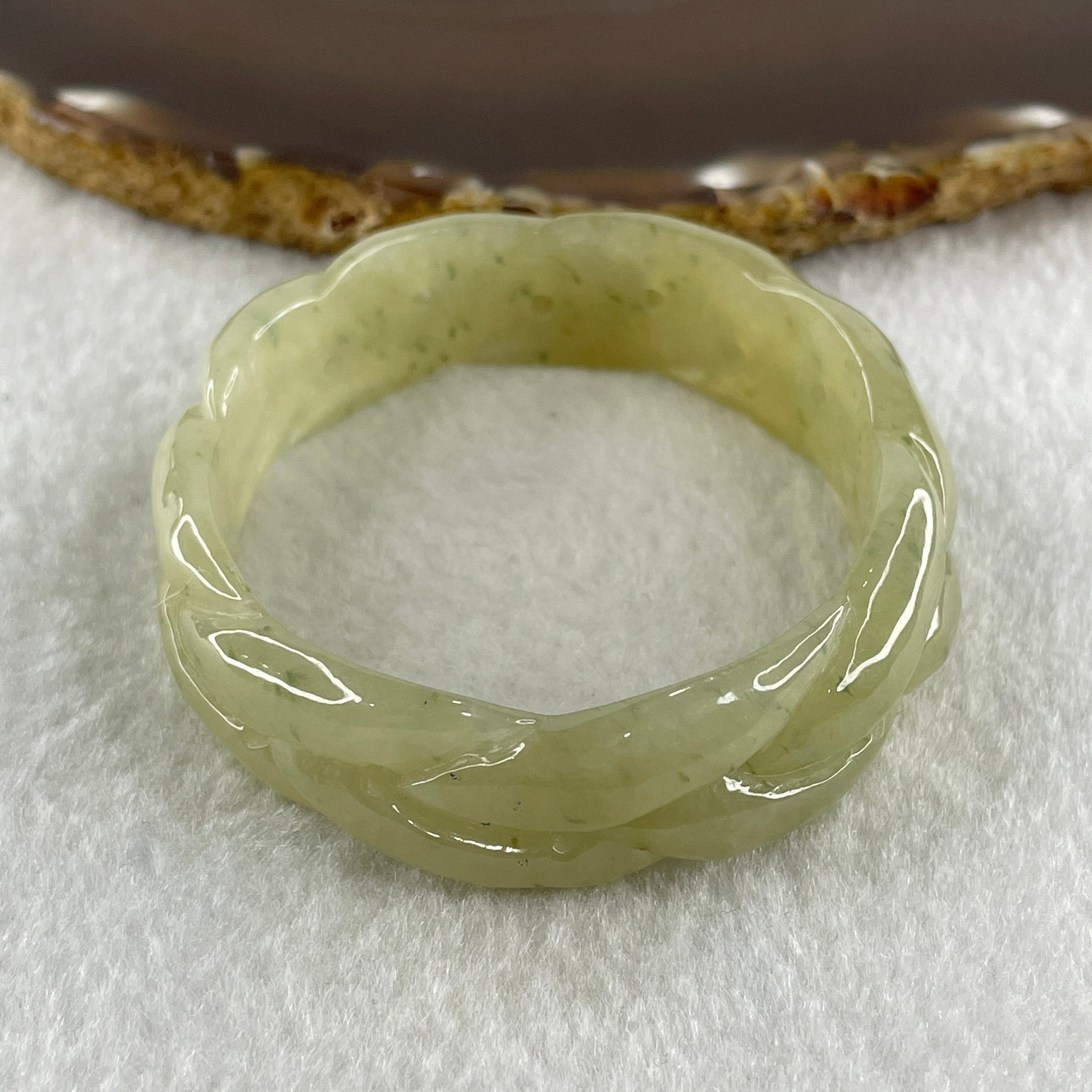 Type A Natural Yellowish Green Jadeite Oval Carved Bangle 41.73g Inner Diameter 54.2mm 16.5 by 7.1mm (Very Very Slight Internal Lines) - Huangs Jadeite and Jewelry Pte Ltd