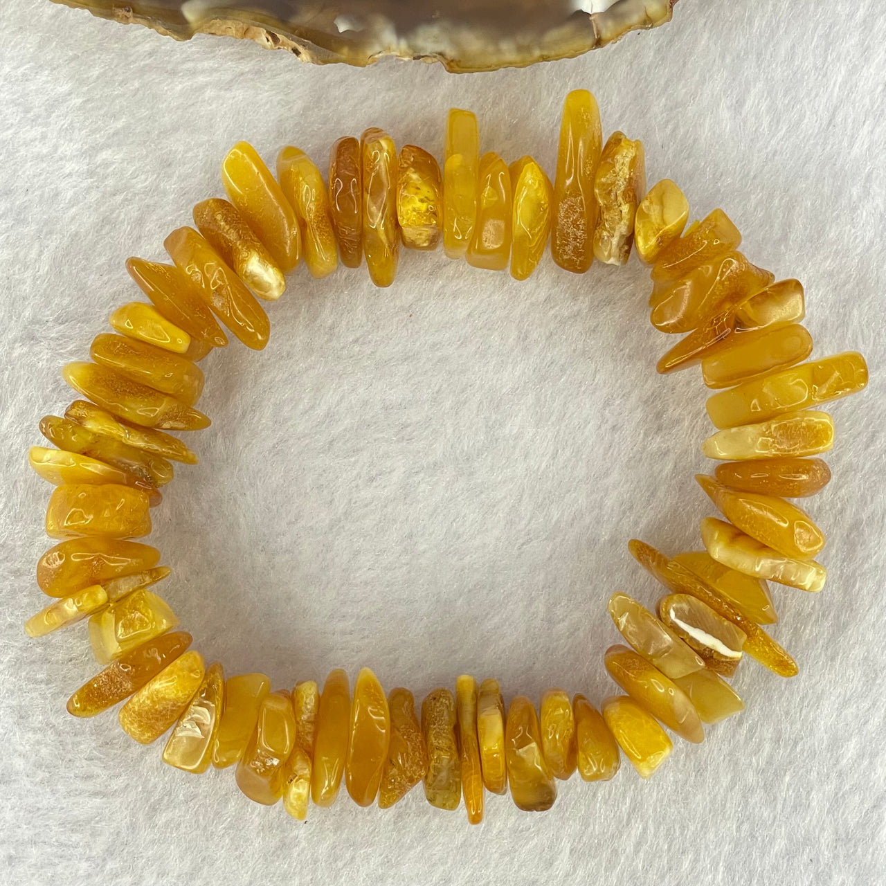 Natural Beeswax Raw Stone Irregular Beads Bracelet 天然蜜蜂蜡原石手链 22.59g 18.5cm 21.6 by 12.6 by 4.7mm, 13.1 by 11.7 by 4.8mm 54pcs - Huangs Jadeite and Jewelry Pte Ltd