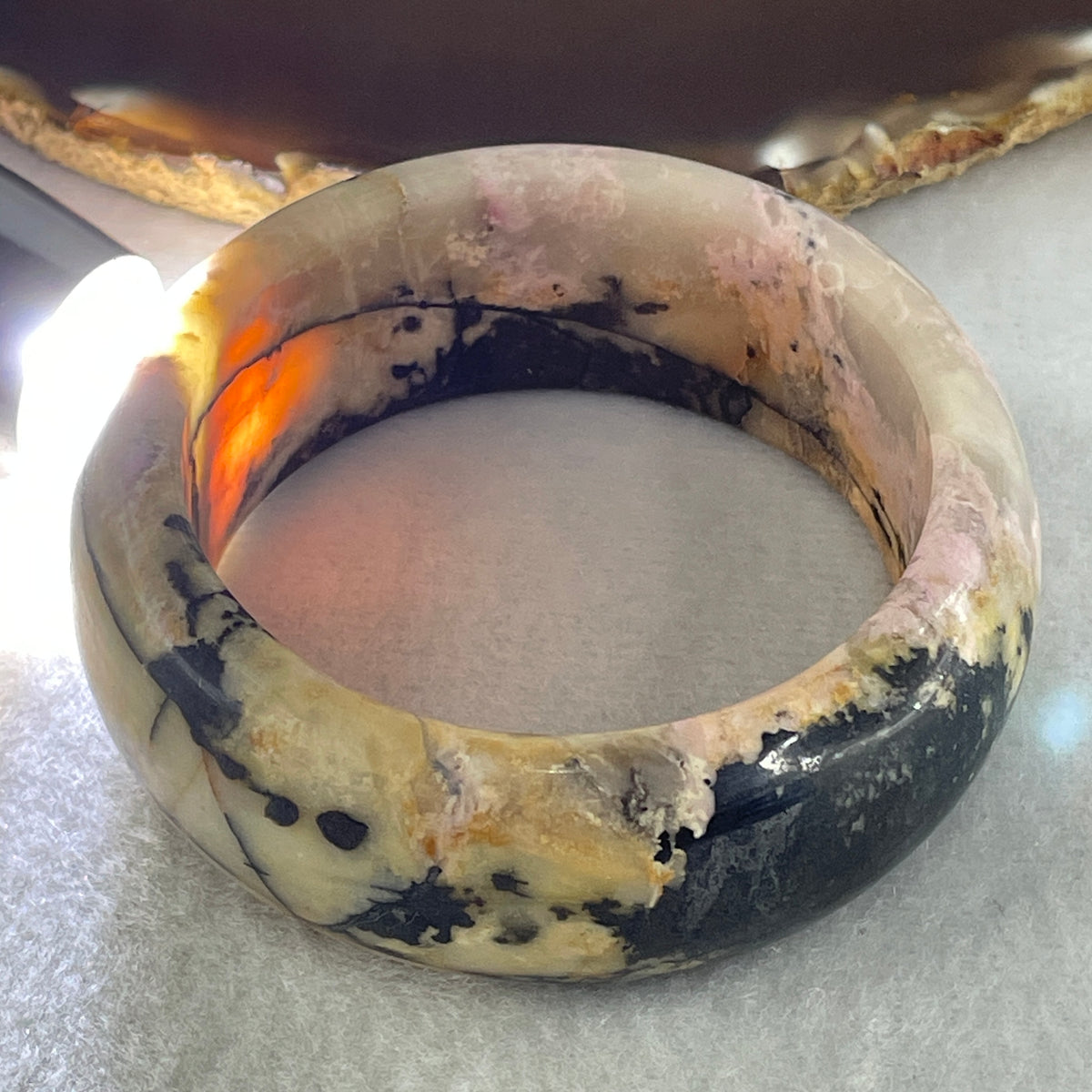 Entry Grade Natural Yellow with Black Rhodonite Bangle 105.93g Inner Diameter 55.2mm 25.5 by 11.7mm - Huangs Jadeite and Jewelry Pte Ltd