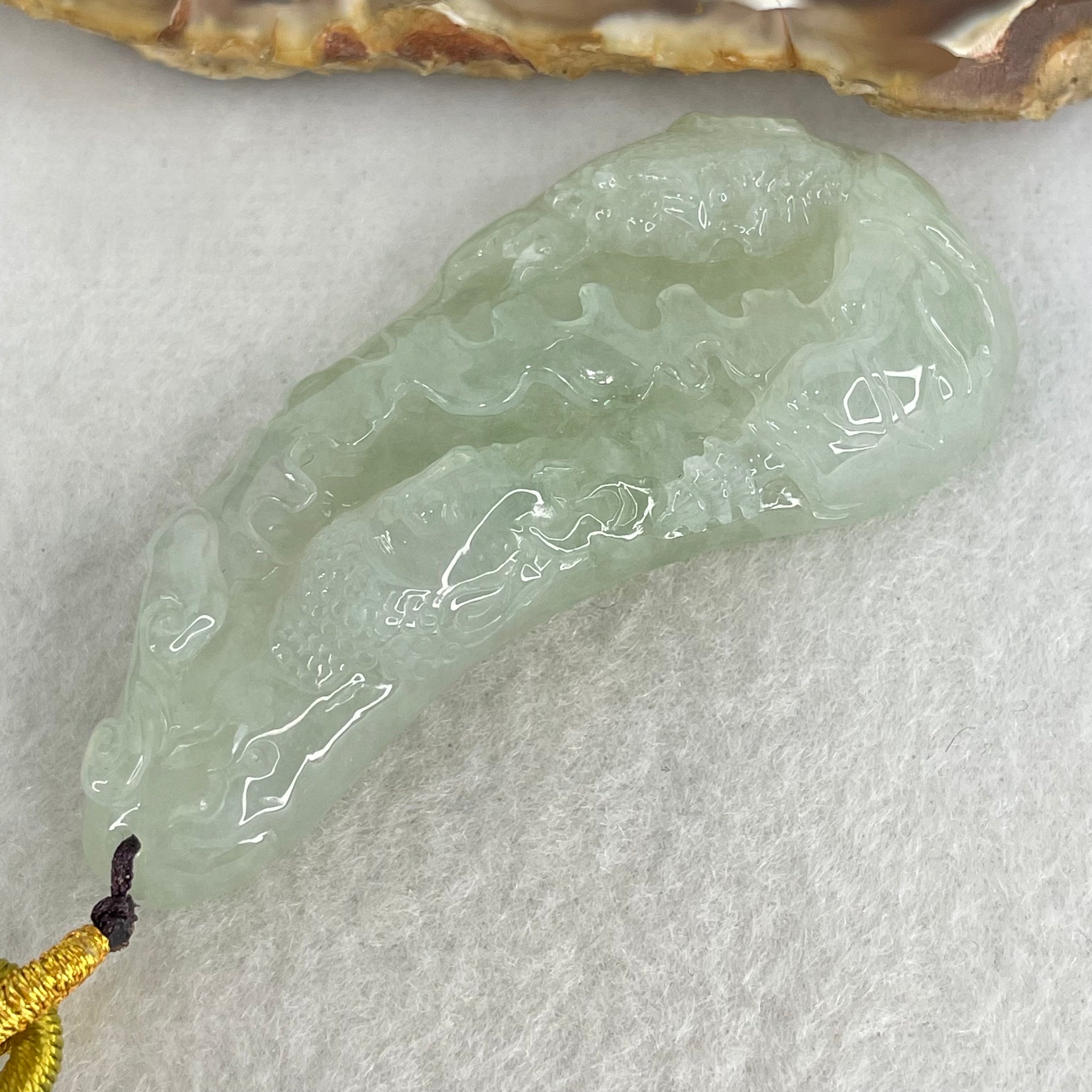 Type A Jelly Light Green Jadeite Buddha and Good Vs Evil Pendant 31.00g 61.2 by 27.0 by 11.4mm - Huangs Jadeite and Jewelry Pte Ltd