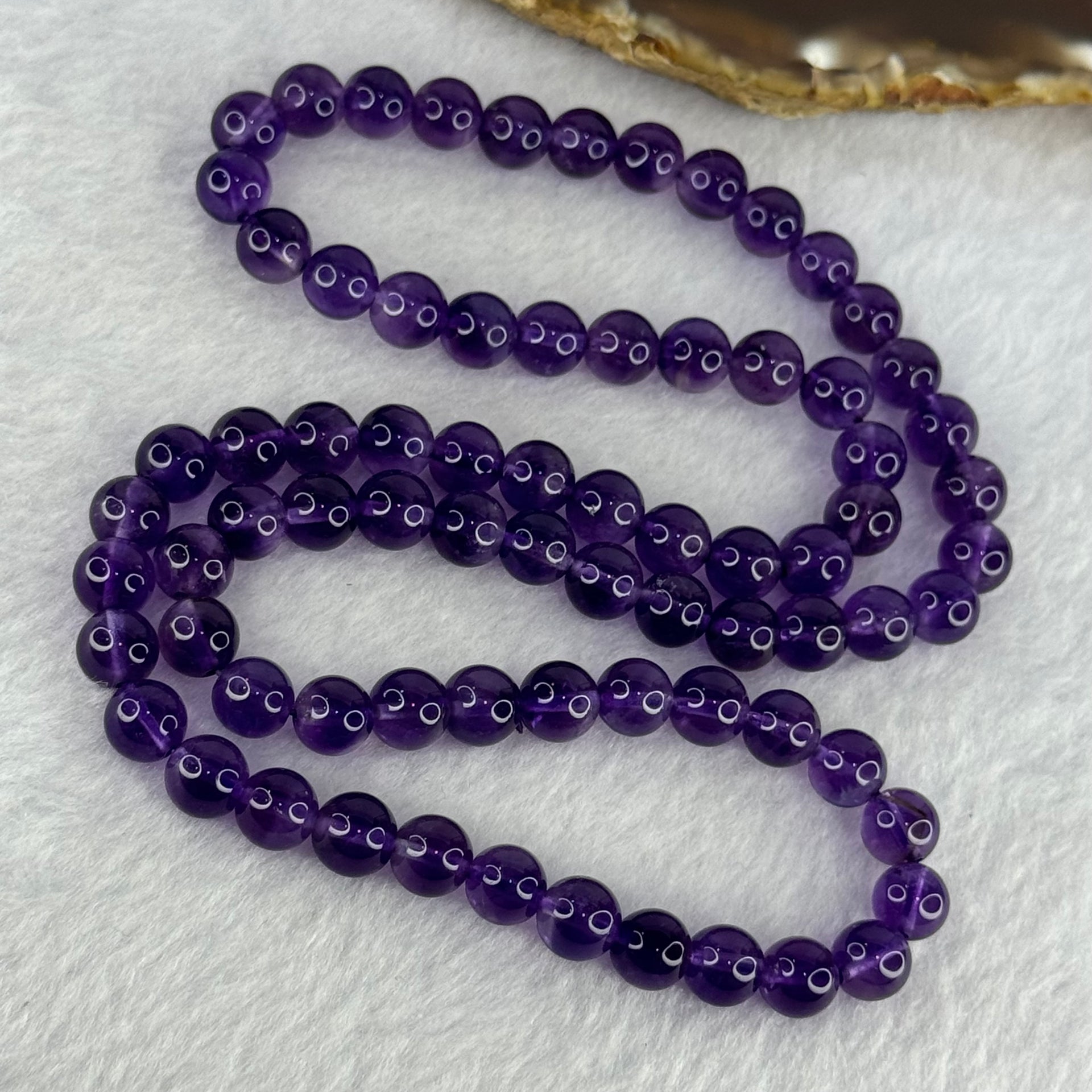 Good Grade Natural Amethyst Necklace 46.46g 52cm 7.7mm 75 Beads - Huangs Jadeite and Jewelry Pte Ltd