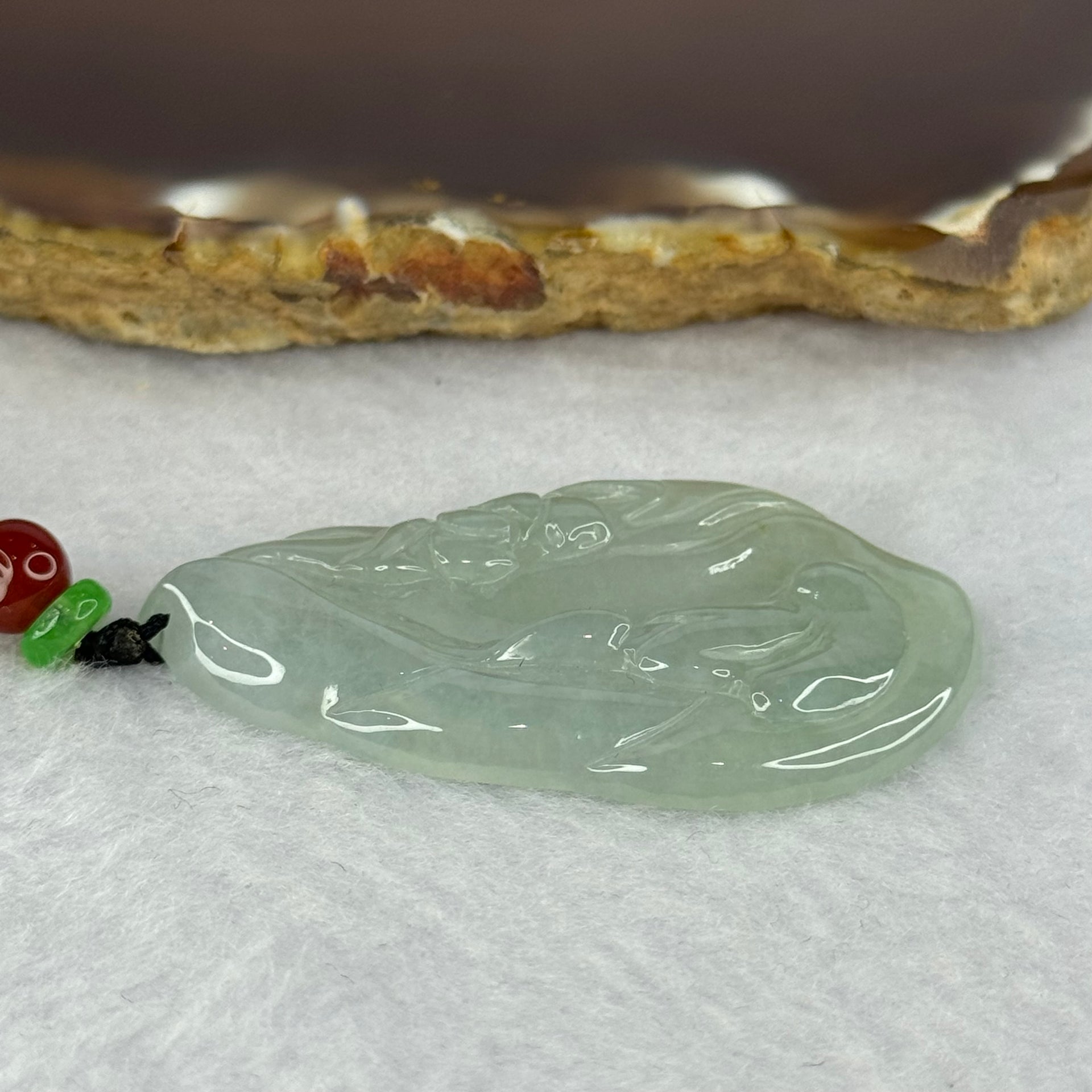 Type A Semi ICY Light Green Jadeite Benefactor with Lotus Flower Pendent 12.08g 46.4 by 27.6 by 4.8mm - Huangs Jadeite and Jewelry Pte Ltd