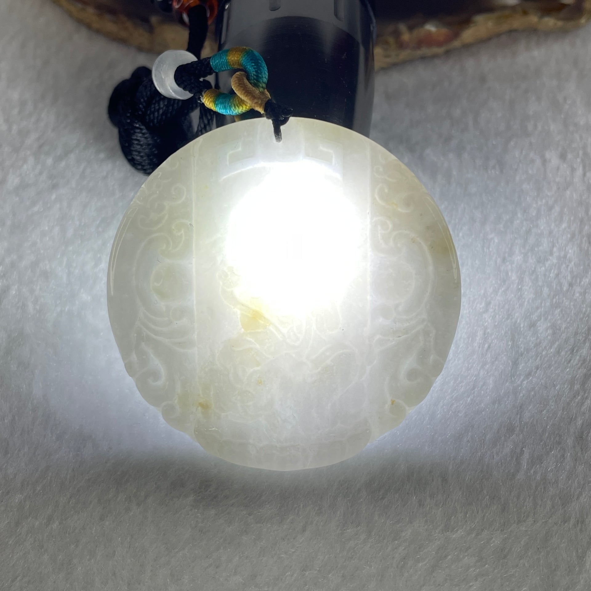 Natural Type A Faint Lavender Faint Green with Red Spots Jadeite Guan Yin Bodhisattva or Siṃhanāda Avalokiteśvara or Guanyin on Lion Roar Pendant 28.42g 51.0 by 5.6mm - Huangs Jadeite and Jewelry Pte Ltd