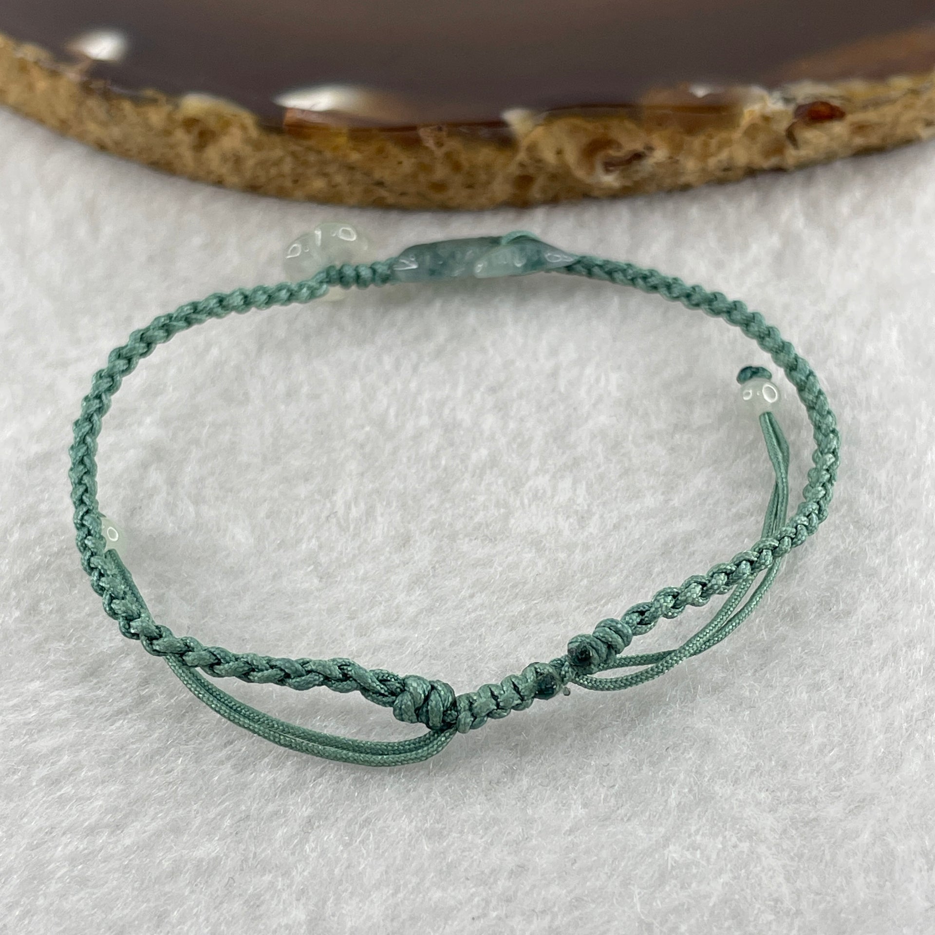 Natural Type A Semi Icy Green with Dark Green Patches Jadeite Fish with Flower on String Bracelet 1.59g 15-18cm 15.6 by 7.9 by 3.5mm - Huangs Jadeite and Jewelry Pte Ltd