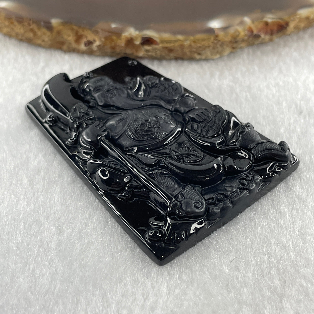 Type A Opaque to Partial Translucent Black Omphacite Jadeite Guan Gong Pendant 29.60g 58.4 by 41.6 by 7.5mm - Huangs Jadeite and Jewelry Pte Ltd