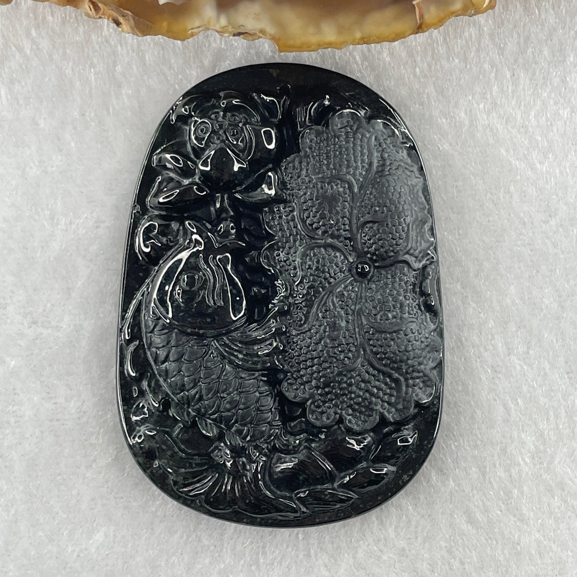 Type A Opaque to Partial Translucent Black Omphacite Jadeite Fish with Lotus Flower and Leaf Pendant 24.60g 51.1 by 35.9 by 8.8mm - Huangs Jadeite and Jewelry Pte Ltd