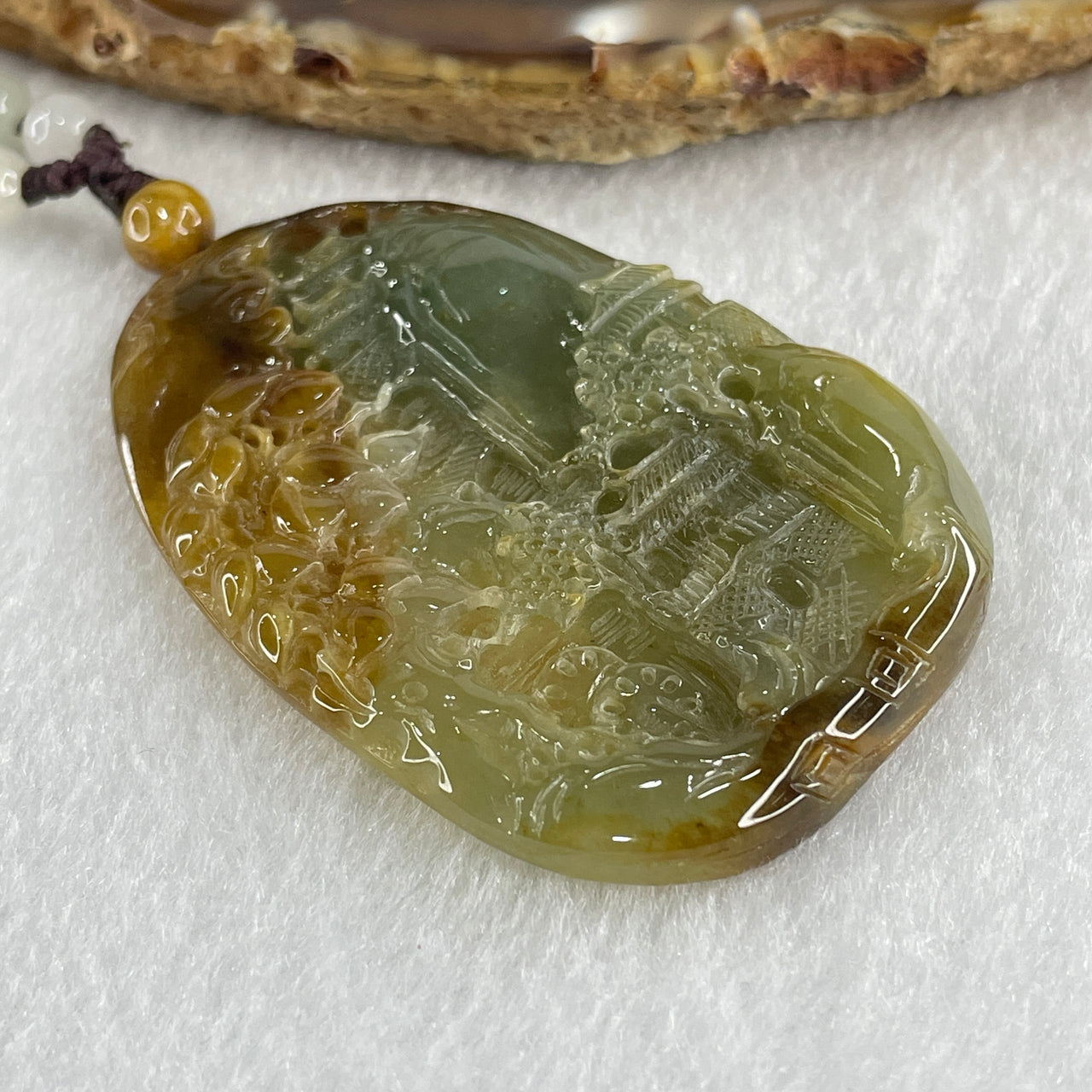 Grand Master Type A Green with Brownish Jadeite Shan Shui with Gui Ren Double Side Pendant 52.28g 55.3 by 38.2 by 7.3mm