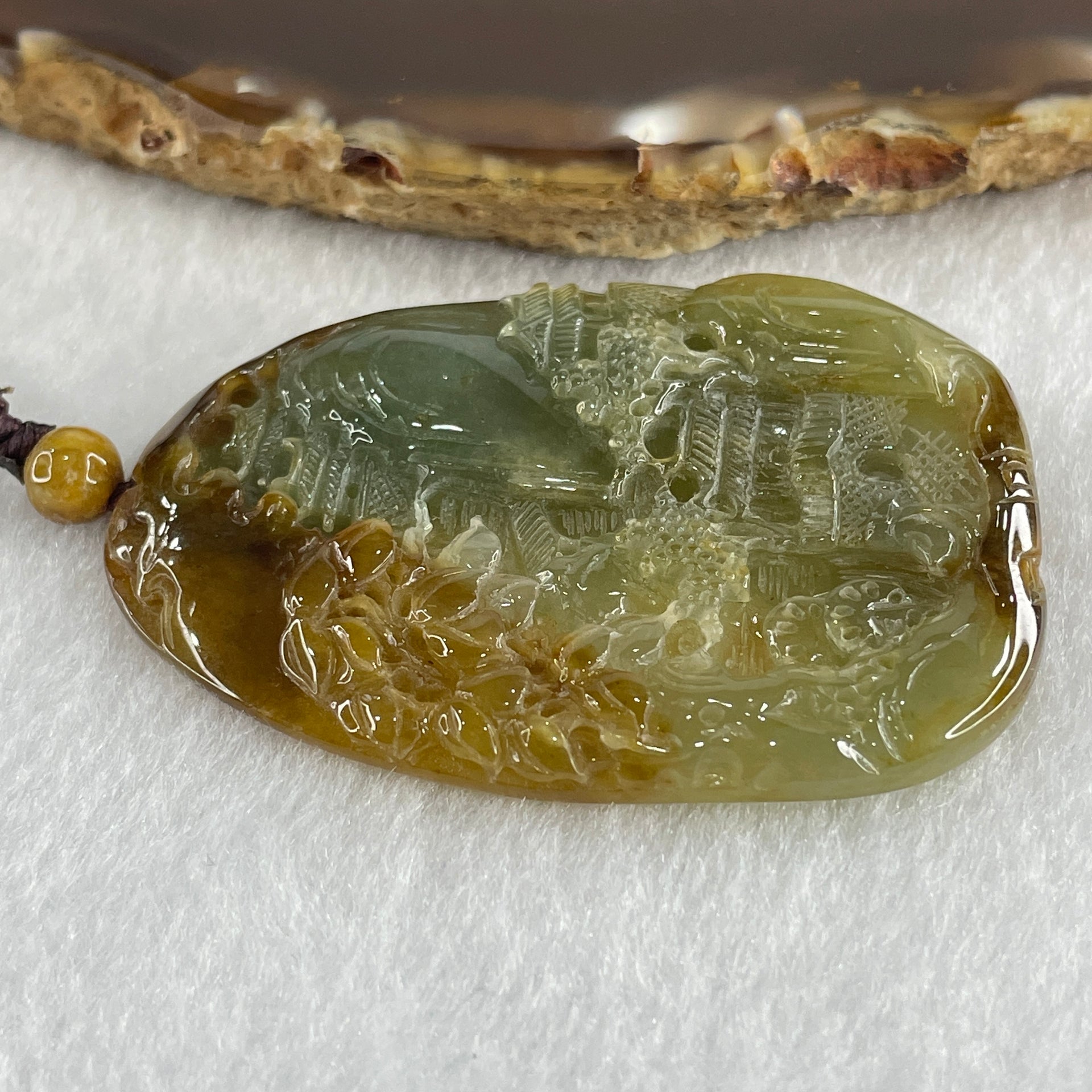 Grand Master Type A Green with Brownish Jadeite Shan Shui with Gui Ren Double Side Pendant 52.28g 55.3 by 38.2 by 7.3mm - Huangs Jadeite and Jewelry Pte Ltd