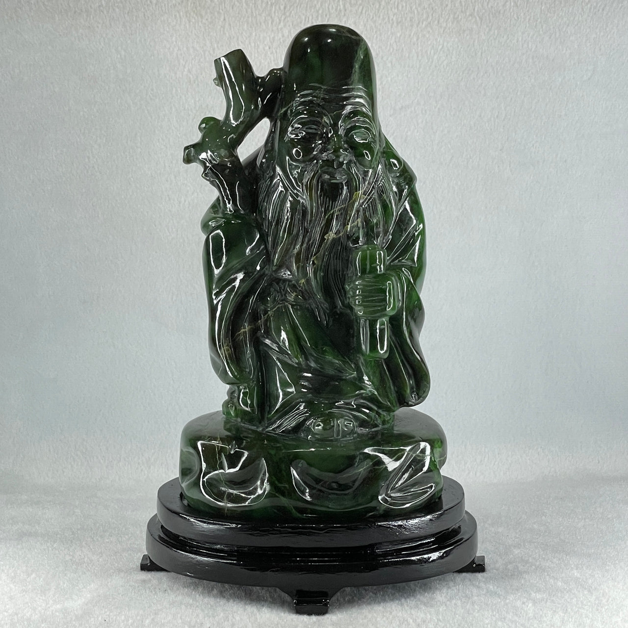 Natural Dark Green Serpentine Shou Xing Gong with Wooden Stand Display 2,374.7g 140.0 by 228.0 by 125.0mm - Huangs Jadeite and Jewelry Pte Ltd