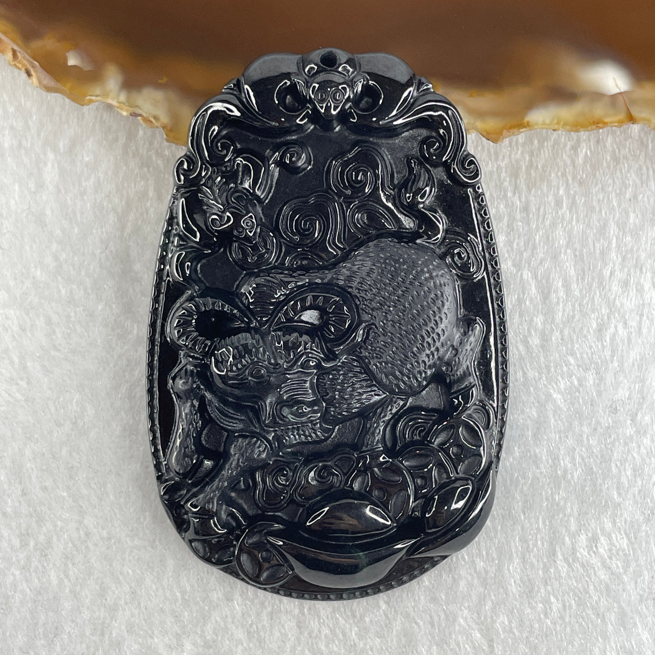Type A Opaque to Partial Translucent Black Omphacite Jadeite Ox Pendant 20.24g 59.5 by 39.4 by 7.6mm - Huangs Jadeite and Jewelry Pte Ltd