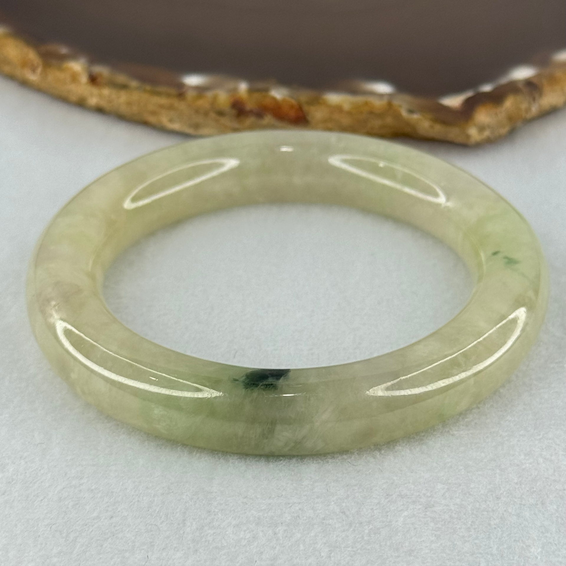 Type A Translucent Semi Icy Light Yellowish Green with Moss Green Patch Jadeite Bangle Internal Diameter 55.3mm 76.40g 12.3 by 11.6mm (Very Slight External Rough) - Huangs Jadeite and Jewelry Pte Ltd