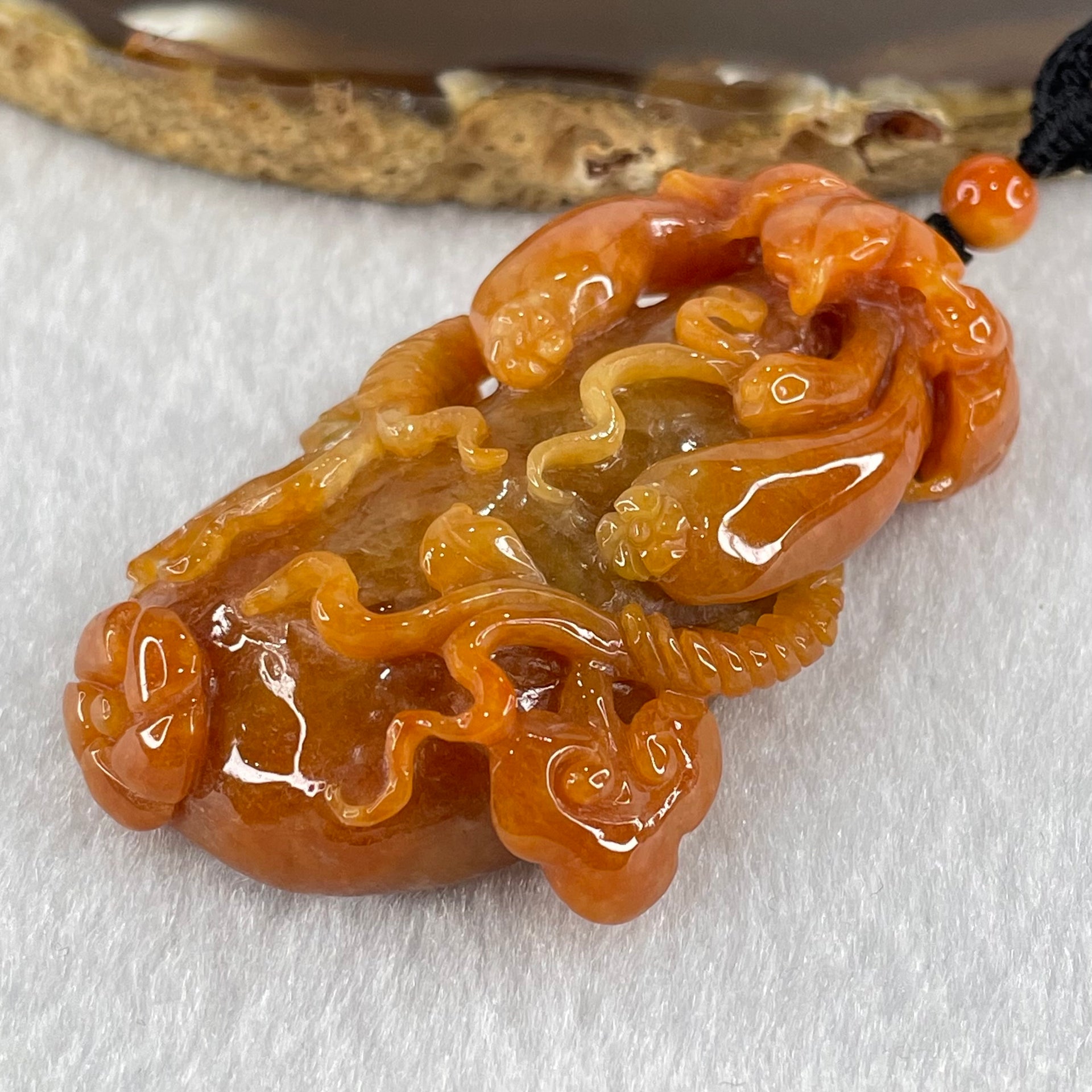 Grandmaster Type A Brownish Orange to Brownish Red Jadeite Melon and Ruyi 福瓜 Pendant 45.95g 58.05 by 34.38 by 15.00mm With NGI Cert 82838787 - Huangs Jadeite and Jewelry Pte Ltd