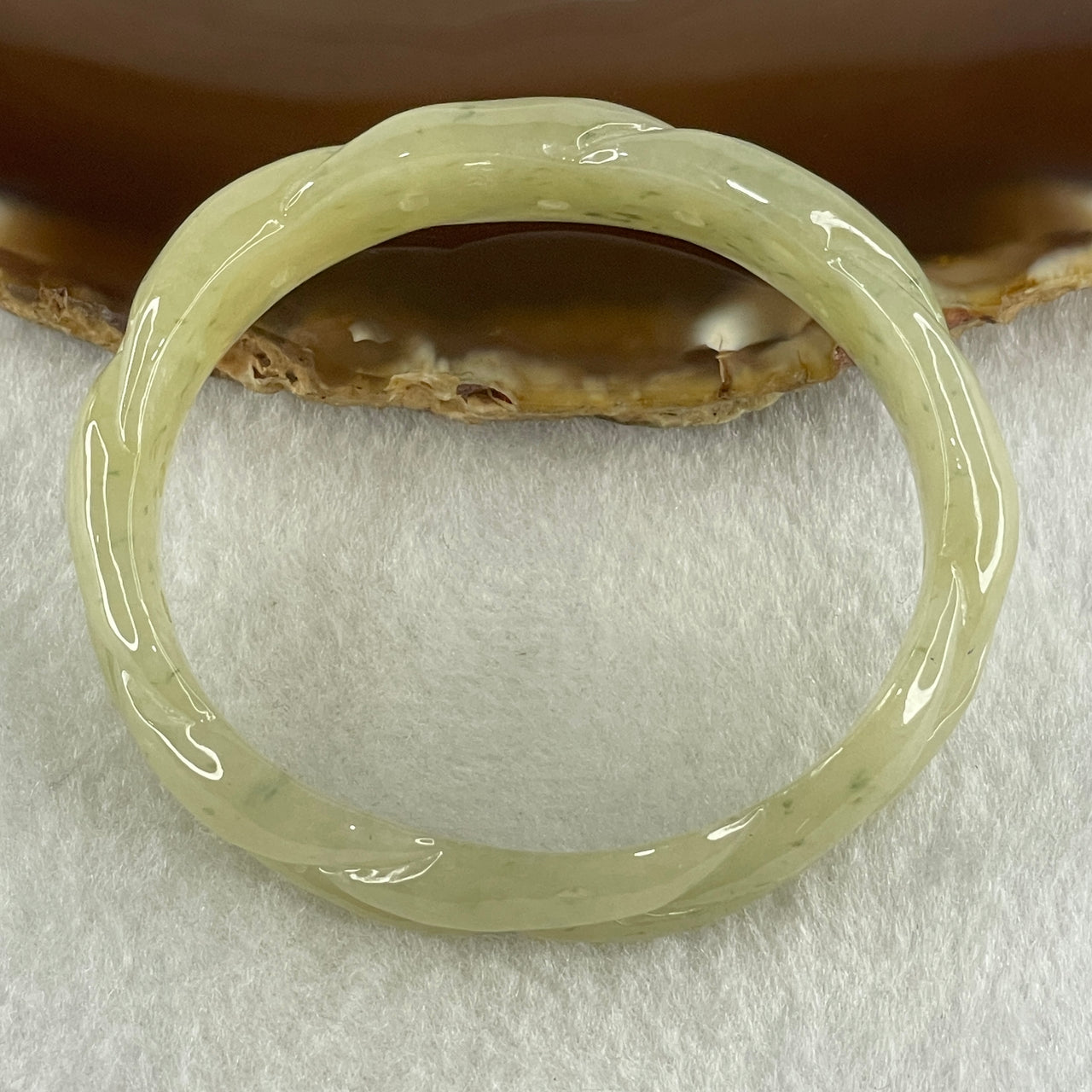 Type A Natural Yellowish Green Jadeite Oval Carved Bangle 41.73g Inner Diameter 54.2mm 16.5 by 7.1mm (Very Very Slight Internal Lines) - Huangs Jadeite and Jewelry Pte Ltd