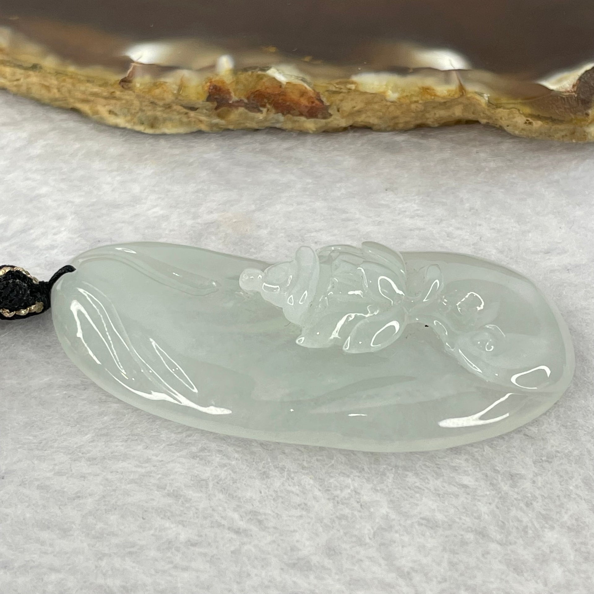 Type A Semi Icy Light Green Jadeite Benefactor on Lotus Flower Pendent 16.22g 52.1 by 26.5 by 7.9mm - Huangs Jadeite and Jewelry Pte Ltd