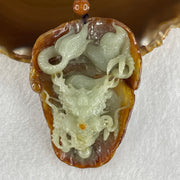 Type A Green with Brownish Jadeite Dragon Pendant 75.51g 68.8 by 49.5 by 28.9mm - Huangs Jadeite and Jewelry Pte Ltd