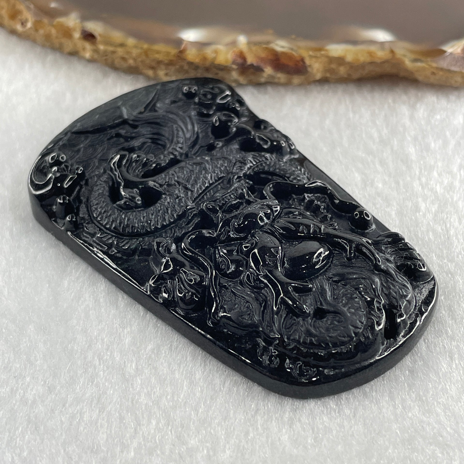 Type A Opaque to Partial Translucent Black Omphacite Jadeite Dragon Pendant 32.91g 66.0 by 42.2 by 9.5mm - Huangs Jadeite and Jewelry Pte Ltd