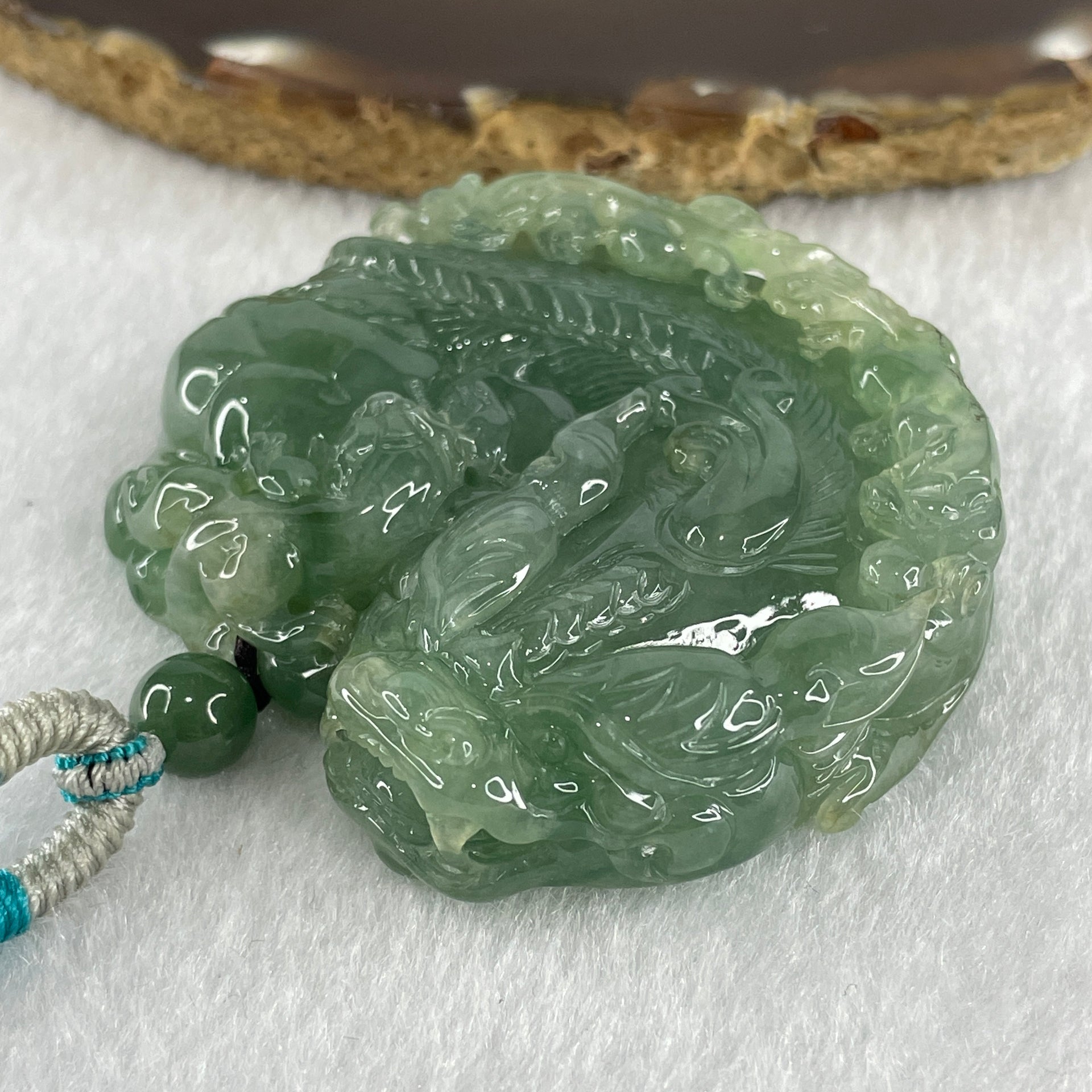 Grand Master Type A Semi Icy Light Green Jadeite Pixiu with 3 Baby Pixiu Double Side Pendant 75.67g 49.0 by 53.5 by 13.3mm - Huangs Jadeite and Jewelry Pte Ltd