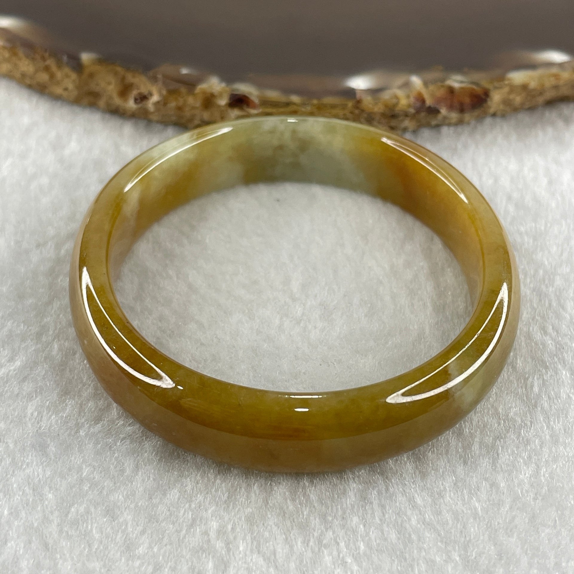 Type A Natural Intense Brownish Yellow Jadeite Oval Bangle 30.33g Inner Diameter 52.7mm 11.0 by 6.5mm (Very Slight Internal Lines) - Huangs Jadeite and Jewelry Pte Ltd