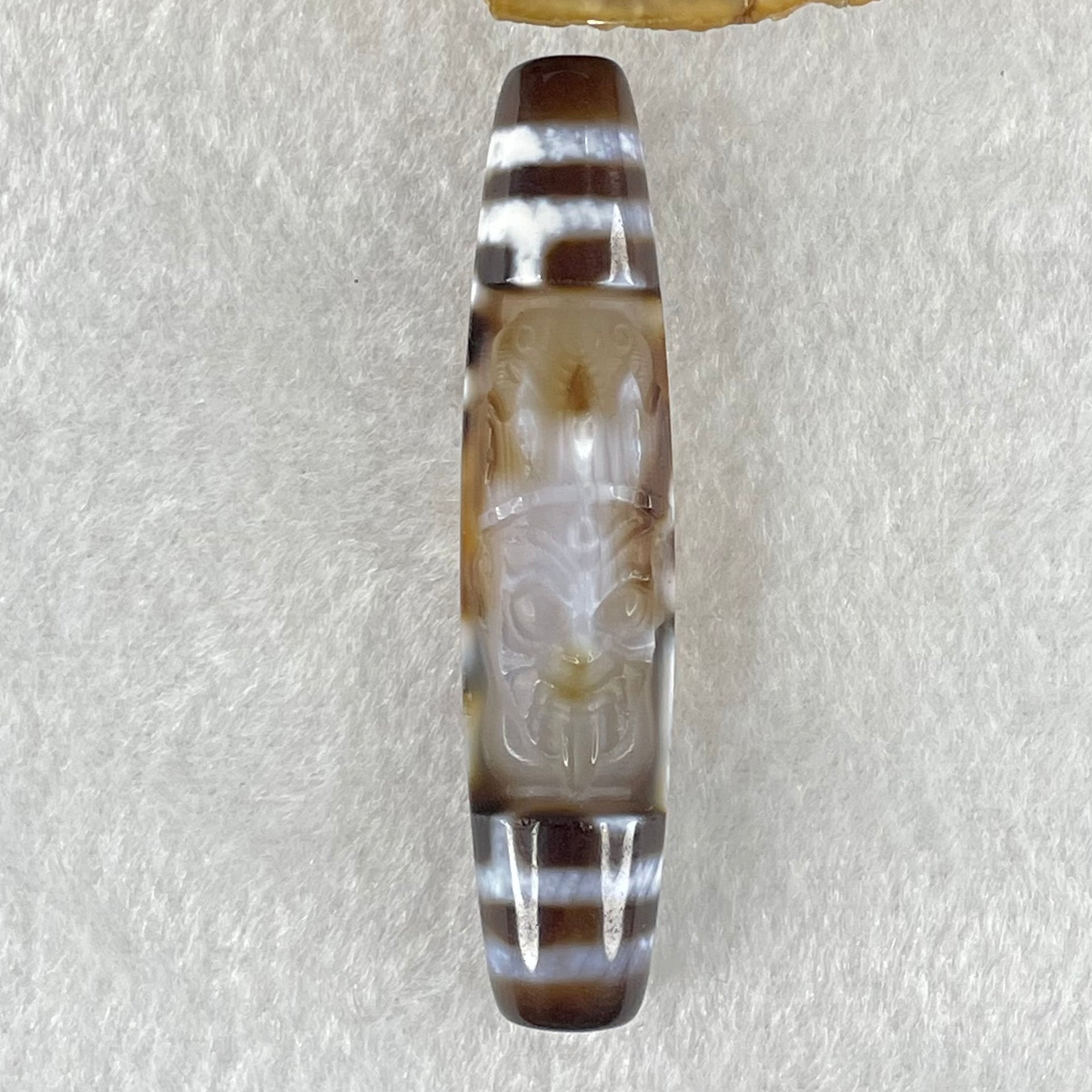 Natural Powerful Tibetan Old Oily Agate Zha Ji La Mu Female Cai Shen Carvings on 9 Eyes Dzi Bead Heavenly Master (Tian Zhu) 九眼扎基拉姆女财神天珠 14.46g 58.4 by 13.0mm - Huangs Jadeite and Jewelry Pte Ltd