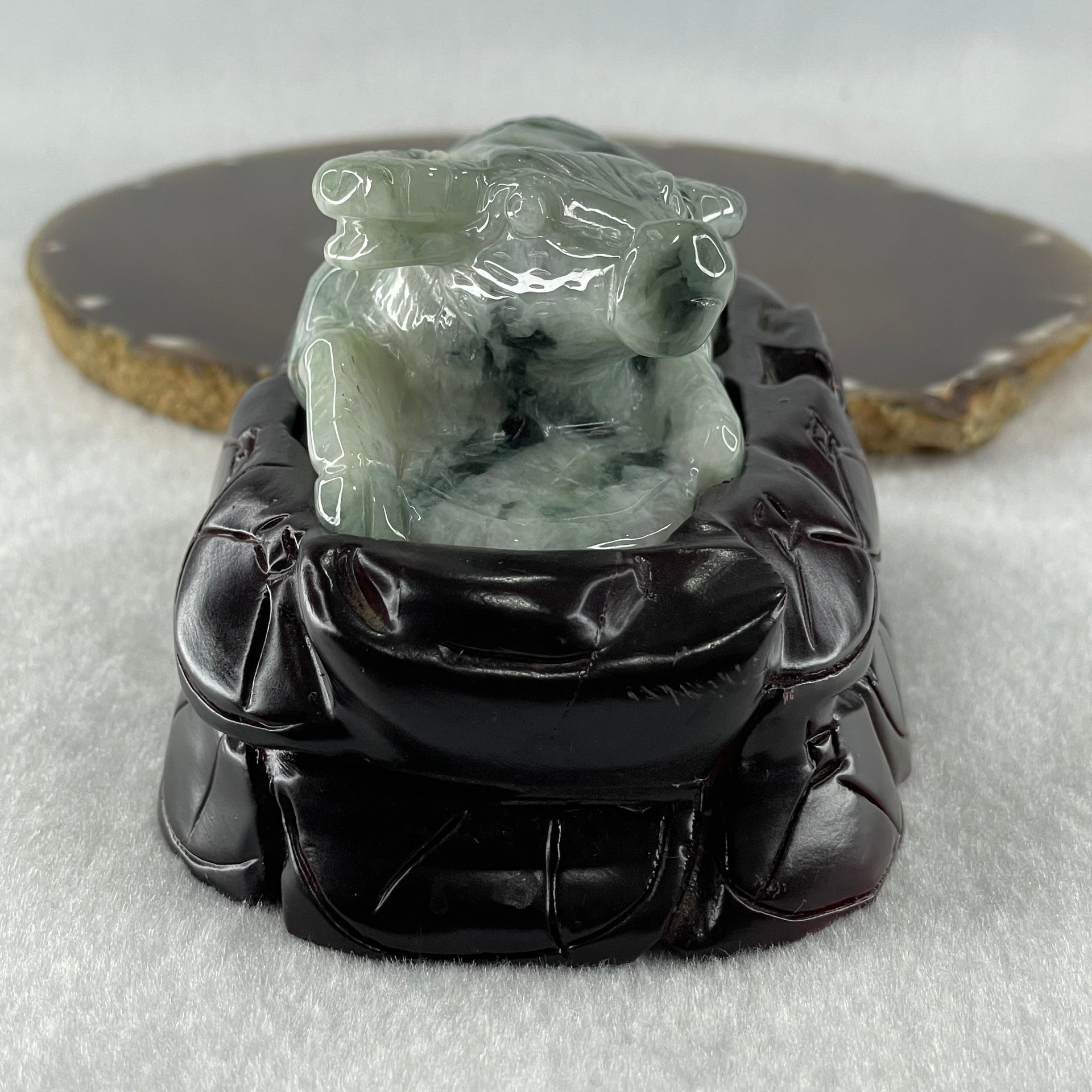 Natural Type A Light Green Light Lavender with Dark Green Patches Jadeite Ox with Wooden Stand Display 341.7g 116.5 by 73.9 by 66.0mm - Huangs Jadeite and Jewelry Pte Ltd