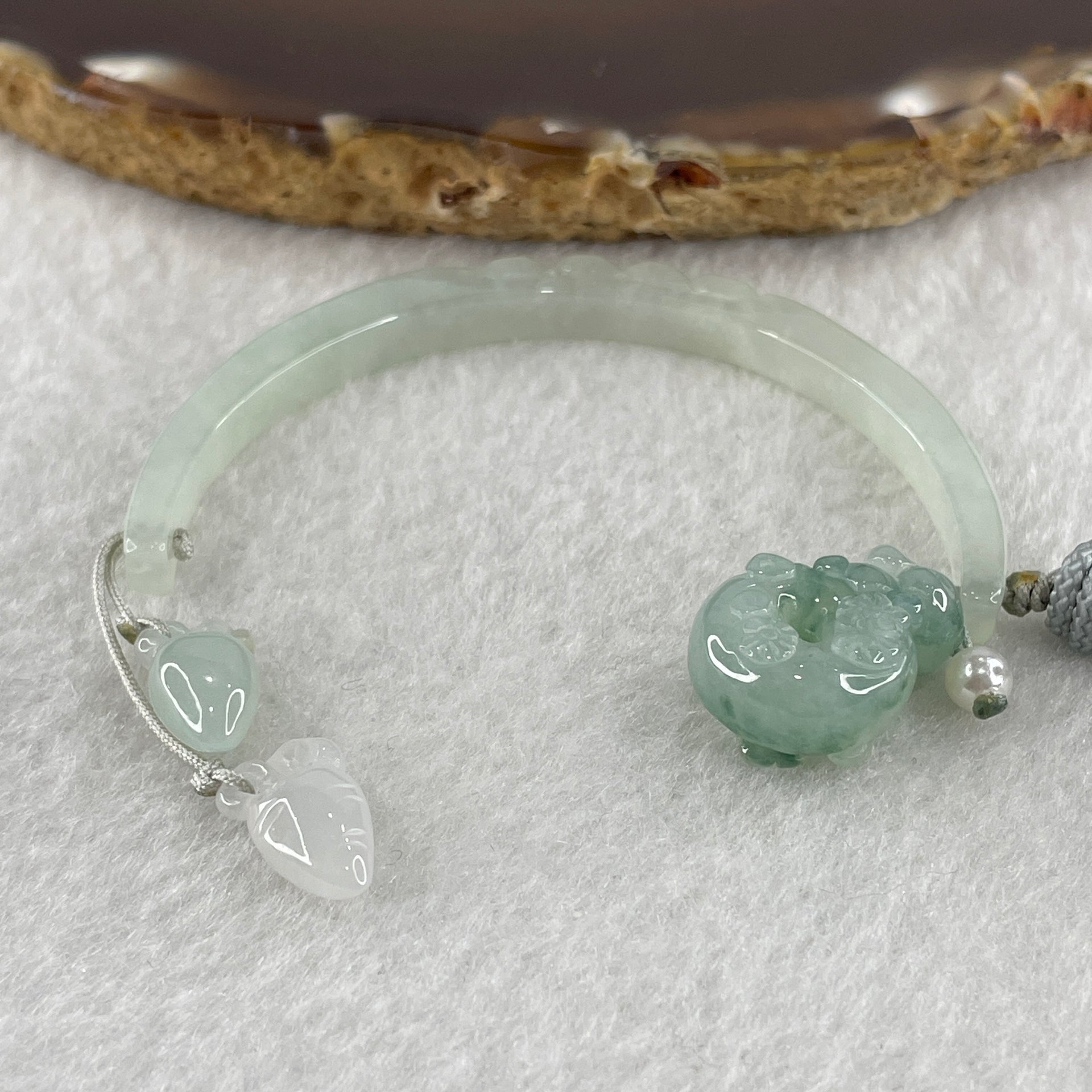 Natural Type A Semi Icy Light Green Jadeite Moon with Rabbit and Flower on Ping An Kou and Carrot Necklace 11.72g 17.2 by 13.6 by 8.6mm Ping An Kou - 56.7 by 4.4 by 5.5mm Moon - Huangs Jadeite and Jewelry Pte Ltd