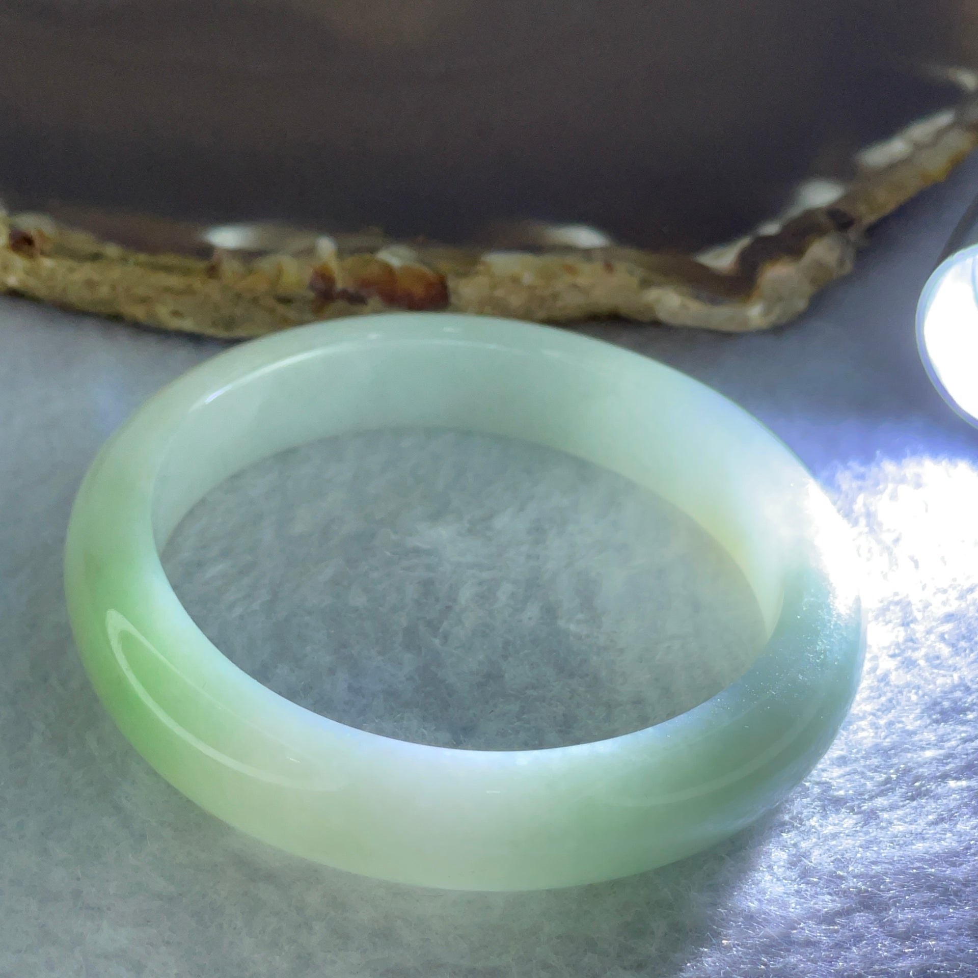 Type A Light Green Jadeite Oval Bangle Internal Diameter 56.2mm 40.54g 11.1 by 7.2mm (Slight Internal Line) - Huangs Jadeite and Jewelry Pte Ltd