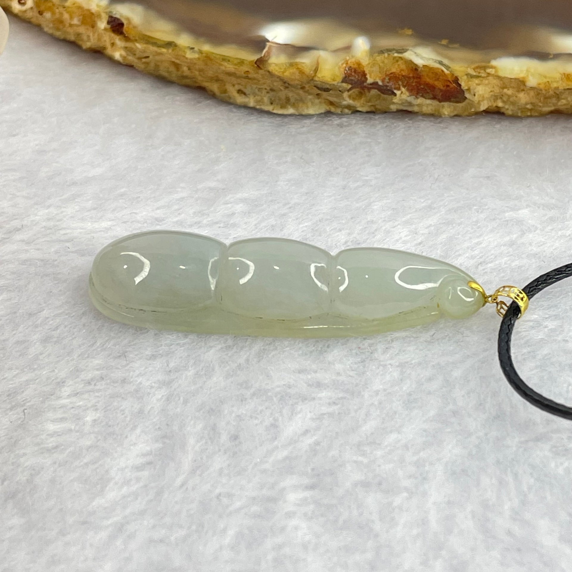 Type A Faint Green Jadeite Peapod Pendent 6.17g 39.1 by 11.3 by 7.1mm - Huangs Jadeite and Jewelry Pte Ltd