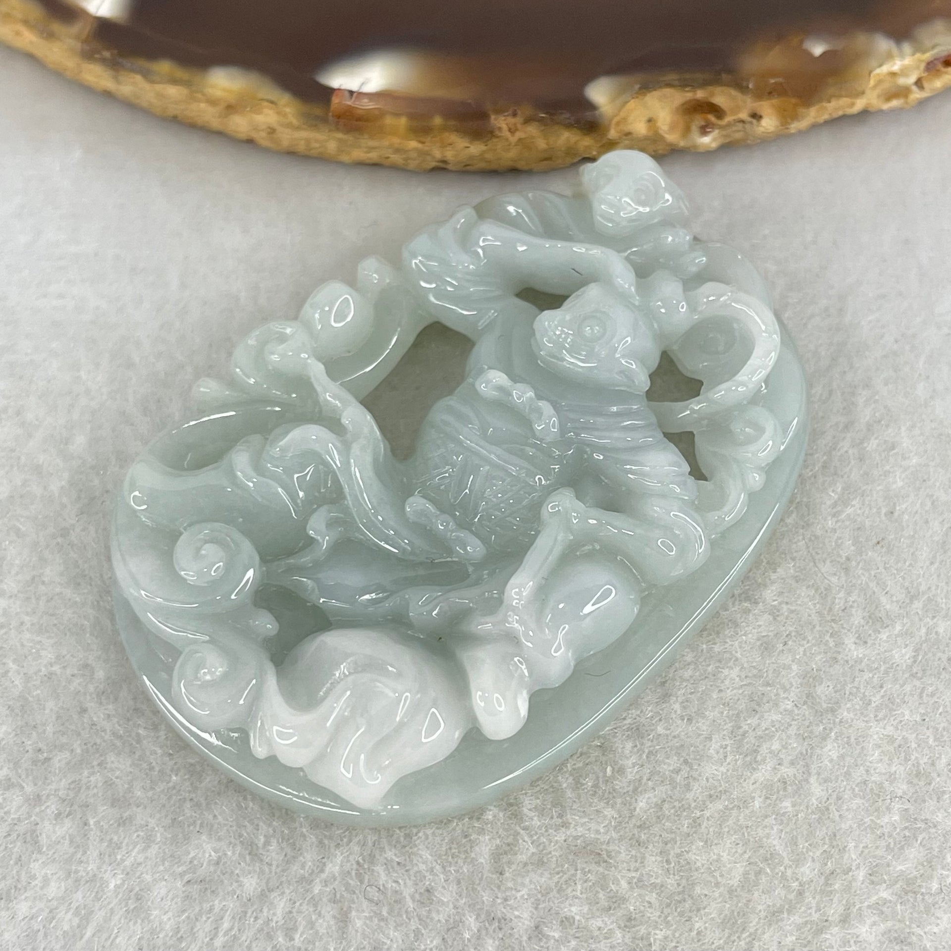 Type A Light Sky Blue Jadeite Sun Wu Kong Pendant 27.49g 52.8 by 37.1 by 11.0mm - Huangs Jadeite and Jewelry Pte Ltd