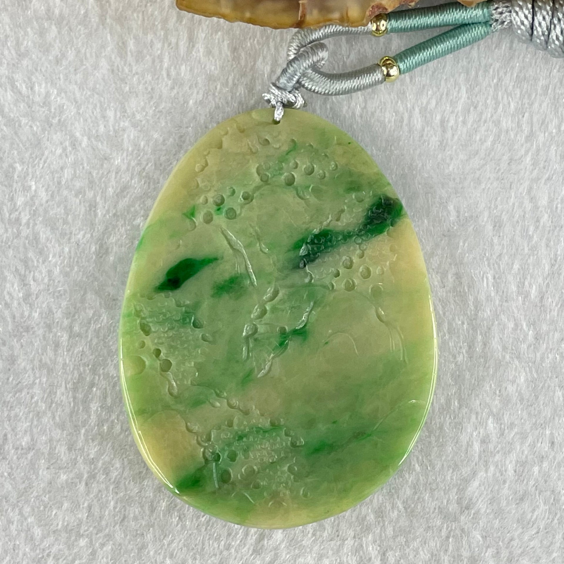 Type A Green with Yellow Spicy Green Piao Hua and Light Brown Patches Jadeite Double Sided Shan Shui with Gui Ren Benefactor Pendant 30.43g 54.0 by 40.8 by 8.4mm - Huangs Jadeite and Jewelry Pte Ltd