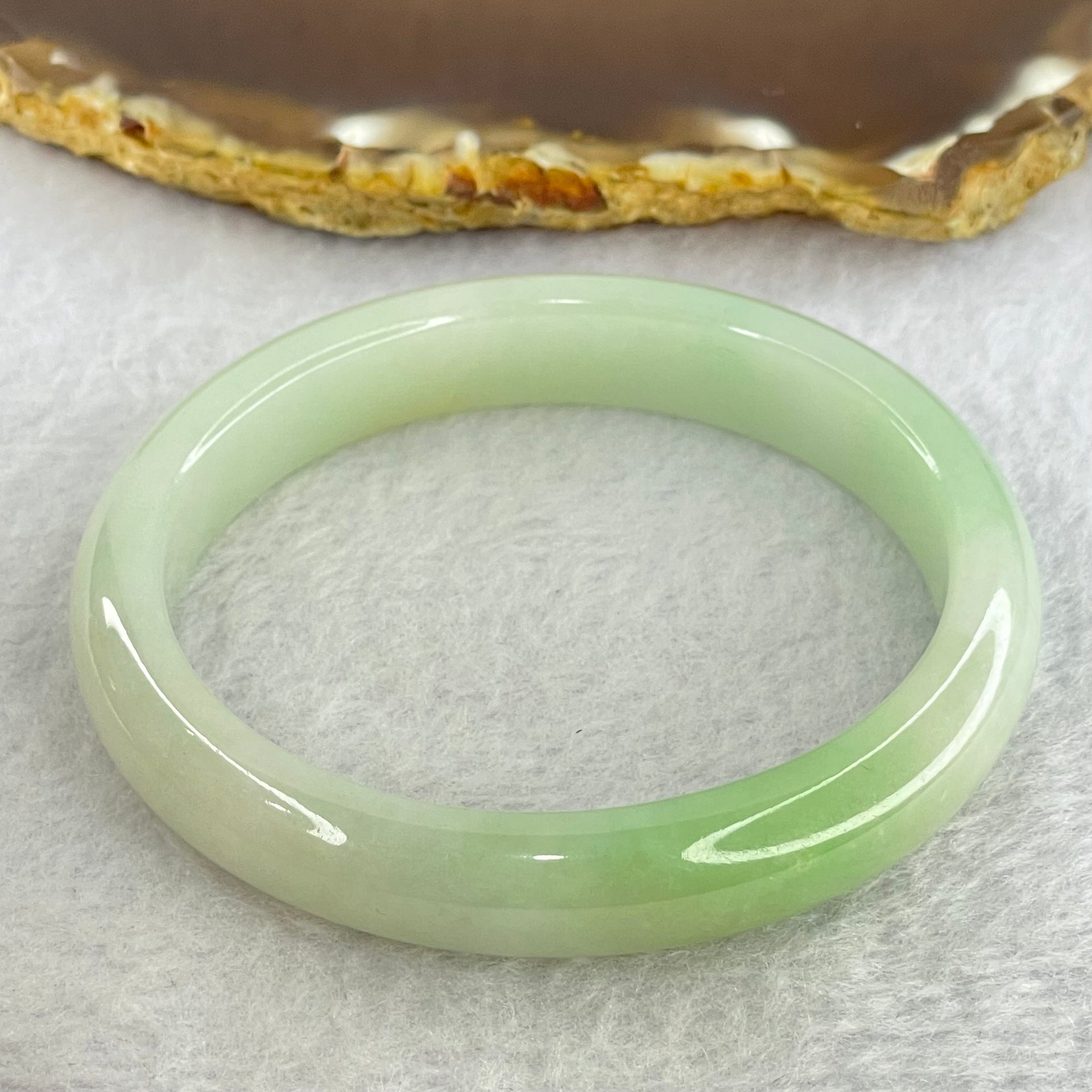 Type A Light Green Jadeite Oval Bangle Internal Diameter 56.2mm 40.54g 11.1 by 7.2mm (Slight Internal Line) - Huangs Jadeite and Jewelry Pte Ltd