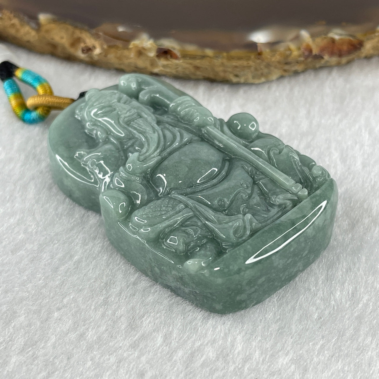 Natural Type A Light Blueish Green Jadeite Seated Guan Gong Pendant 48.52g 52.5 by 33.8 by 12.7mm