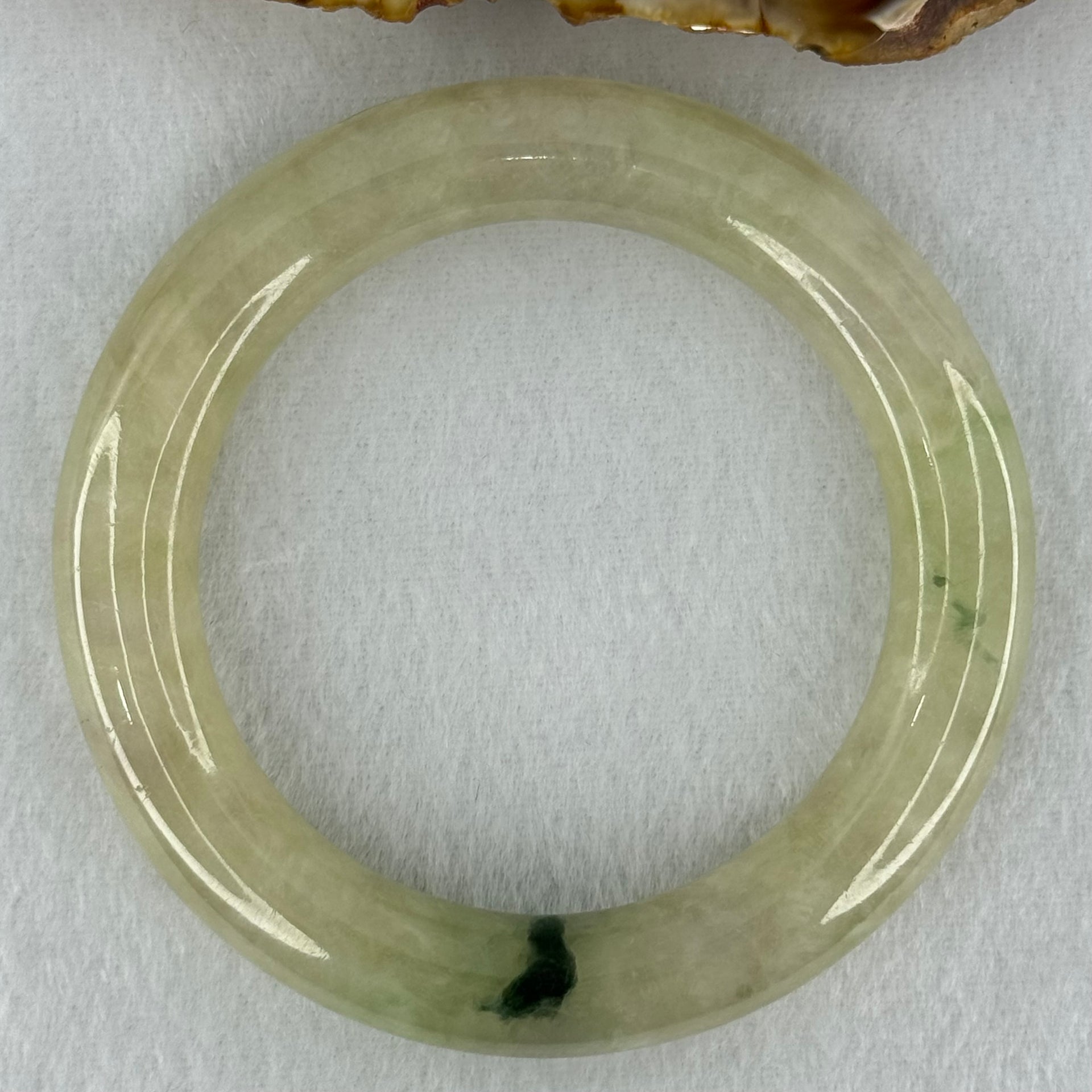 Type A Translucent Semi Icy Light Yellowish Green with Moss Green Patch Jadeite Bangle Internal Diameter 55.3mm 76.40g 12.3 by 11.6mm (Very Slight External Rough) - Huangs Jadeite and Jewelry Pte Ltd